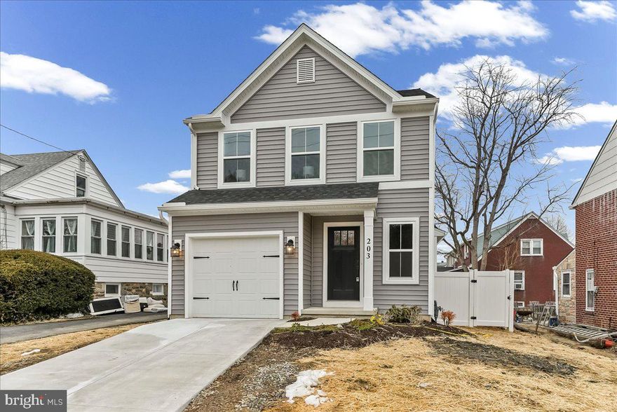 Welcome to this beautifully crafted new construction Colonial at 203 Chestnut Parkway in Wallingford, in the award winning Wallingford-Swarthmore School District, where classic curb appeal meets modern design. With its charming facade featuring wide-trimmed windows, coach lighting, and attached garage, and located this home offers timeless style from the moment you arrive.


Inside, an open and airy main level showcases 9-foot ceilings, wide-plank flooring, and an abundance of natural light. The thoughtfully designed kitchen anchors the home with crisp Merillat Birch cabinetry, quartz countertops, GE gas range and microwave, a spacious center island with stainless steel sink and statement faucet, built-in GE dishwasher, large pantry, recessed lighting with dimmers, and elegant pendant fixtures. The seamless flow into the dining and living areas creates an inviting space ideal for both entertaining and everyday living, with sliding doors leading directly to the private rear patio.


Upstairs, the primary suite provides a comfortable retreat featuring 2 closets, including a large walk-in, a beautifully finished bath with quartz double-bowl vanity, modern black fixtures, and a sleek tiled shower with glass enclosure. Two additional generously sized bedrooms, a hall bath with quartz countertop and tub/shower combination, and convenient second-floor laundry hookups complete the level. Neutral carpeting throughout enhances the home’s warm and welcoming feel.


The finished basement expands your living space with a bright recreation room ideal for a home office, gym, or media area boasting recessed lighting and 9-foot ceilings, along with dedicated storage and utility areas. Outside, the fully privacy-fenced rear yard and concrete patio offer the perfect setting for relaxation or outdoor gatherings.


With over 2,000 square feet of finished space, quality craftsmanship throughout, and a desirable Wallingford location, this home offers modern comfort in a classic Colonial design. Tours start Friday, March 6th. Schedule your tour, fall in love then submit an offer sellers cannot refuse and start packing!