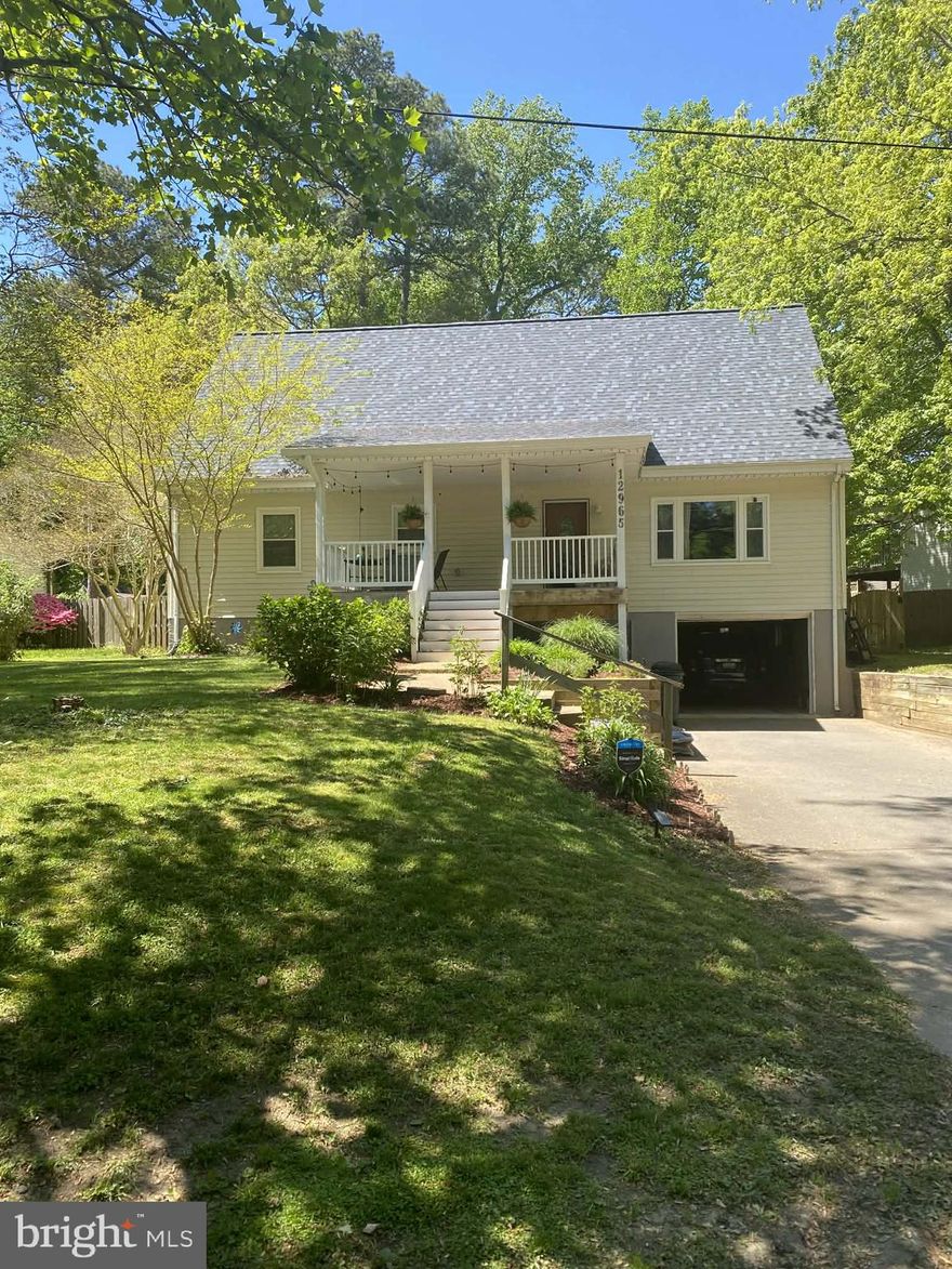 Deceptively spacious cape cod in highly sought after Drum Point community. This house features four, fully renovated, full-size bathrooms; five spacious bedrooms; new carpet upstairs; hickory hardwood on main level; renovated kitchen with quartz countertops and newer stainless steel appliances; a new roof; new HVAC; spacious 1 1/2 car garage (ample room for a large vehicle and a golf cart, which you will frequently see cruising around this waterfront neighborhood). The living room, kitchen, and dining areas are open concept and great for entertaining. The house is a short walk from Drum Point community beaches. Huge master bedroom with walk-in closet. Spacious, unfinished basement can feature as a gym and/or game-room. Large front and back porches for grilling and entertaining. Nice, flat fenced-in back yard features huge shed with attic for additional storage.
