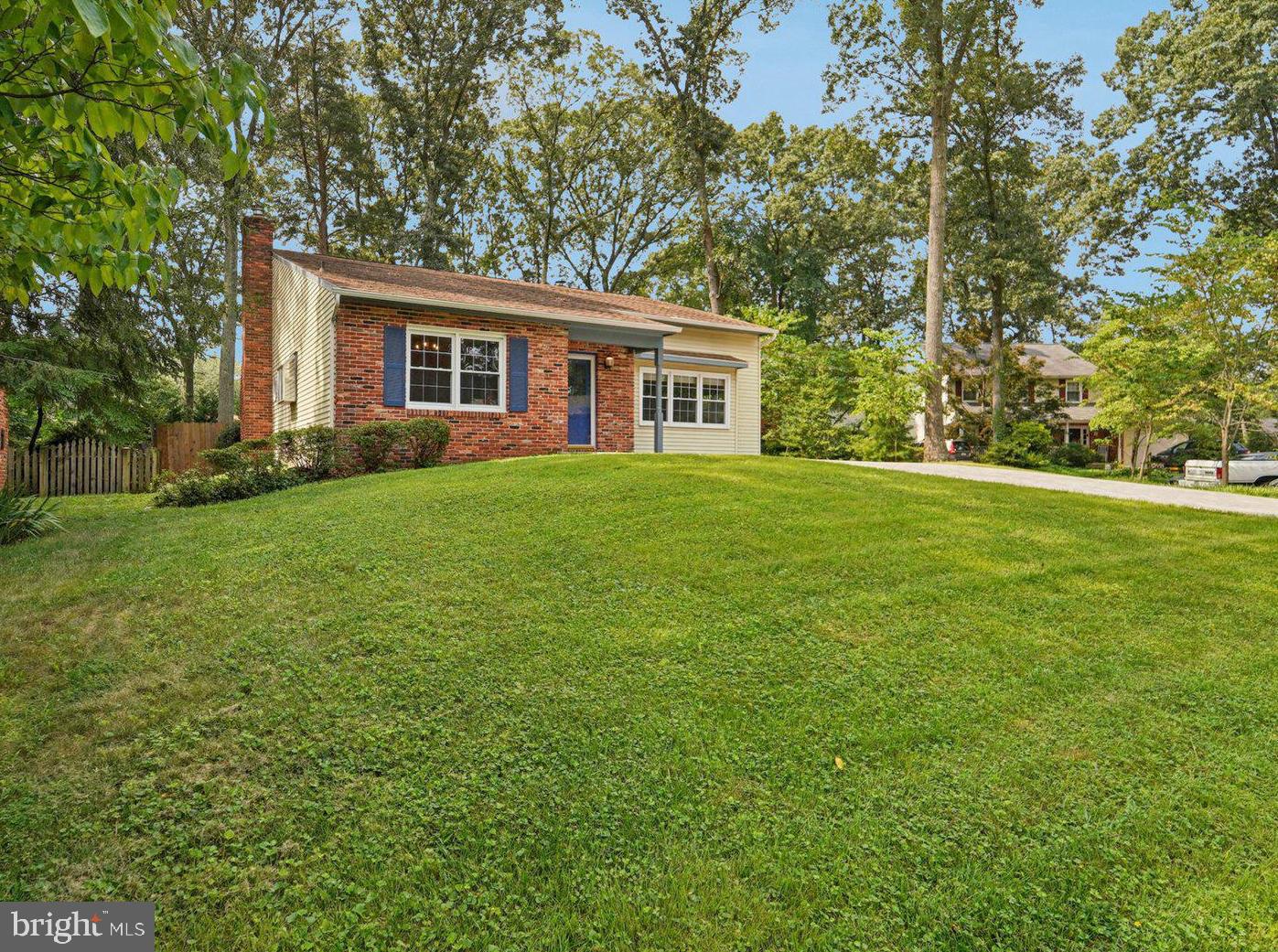 Welcome to this spacious(2400 sq ft.) and thoughtfully expanded 4-bedroom, 3-bath home offering versatile living in a welcoming Severna Park community! A main-level bedroom suite provides convenience and flexibility, while the upper-level primary suite has been beautifully enlarged and includes a cozy fireplace and expanded ensuite bath. The owners added the hardwood floors that span most of the main and upper levels, and the soaring two-story living room features a wood pellet stove that warms much of the home during cooler months. The kitchen overlooks the family room with a wood-burning fireplace and access to a screened porch—ideal for relaxing or entertaining—leading to the fenced backyard. Additional updates include newer windows, an 8-year-old roof, and a stamped concrete driveway with parking for 5–6 cars. Enjoy peace of mind and comfort in every season. The community HOA includes access to the outdoor pool, playground, ball fields and courts, picnic pavilion and common areas, and you're just a short walk to Severna Park Middle School and scenic Kinder Farm Park—perfect for outdoor enthusiasts and families alike!