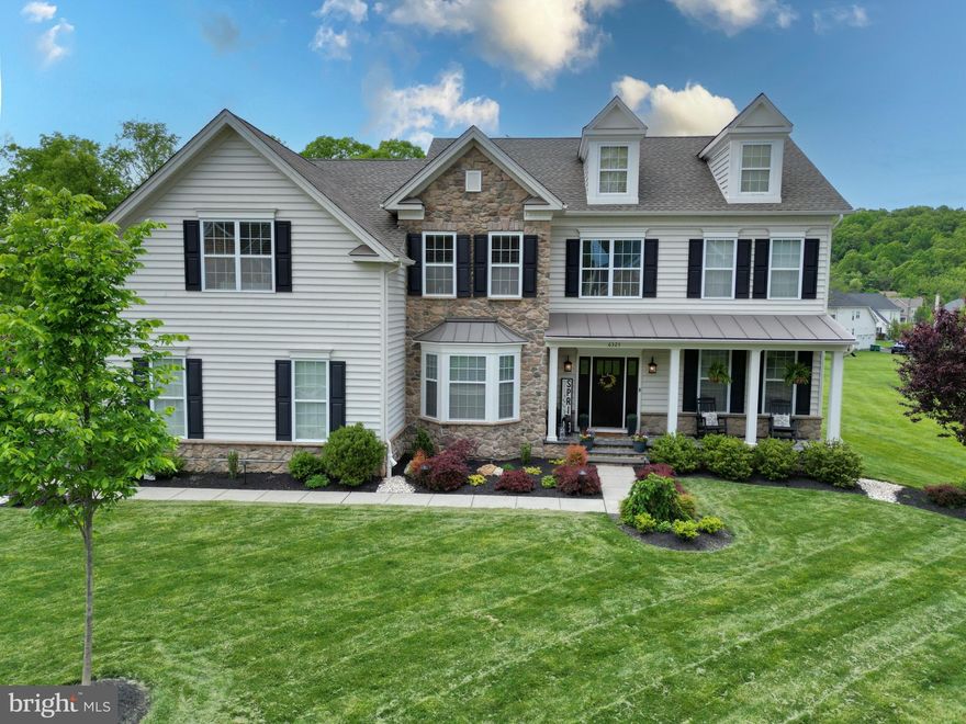 Rare opportunity to own this pristine home in Weyhill Estates at Upper Saucon with first-floor in-law suite, finished basement, covered front porch and 3 car garage. Set against the privacy of a protected tree area this home in the Southern Lehigh School District is sure to impress. The well-equipped gourmet kitchen overlooks the expansive family room with private second staircase and stone to ceiling gas fireplace. From the breakfast area step out into the oasis of a backyard complete with professional landscaping, privacy trees, paver patio, gazebo and firepit all enclosed with an anodized aluminum fence. Back inside you will find a sunny office located off the 2 story foyer as well as open living/dining rooms perfect for large gatherings. The first floor also features the private in-law suite complete with sitting area and full bath with walk-in shower. The second floor offers four ample bedrooms including a princess suite with private bath. The master bedroom suite incorporates a sitting area perfect for a second office, two-large walk-in closets and a master bath with separate shower, dual vanities and soaking tub. The finished lower level with access to the backyard offers a spacious family room, rec area and another full bathroom plus plenty of additional storage. Conveniently located just minutes from I-78, close to area hospitals, the Promenade Shops and Saucon Valley Country Club. Please schedule your private showing today.