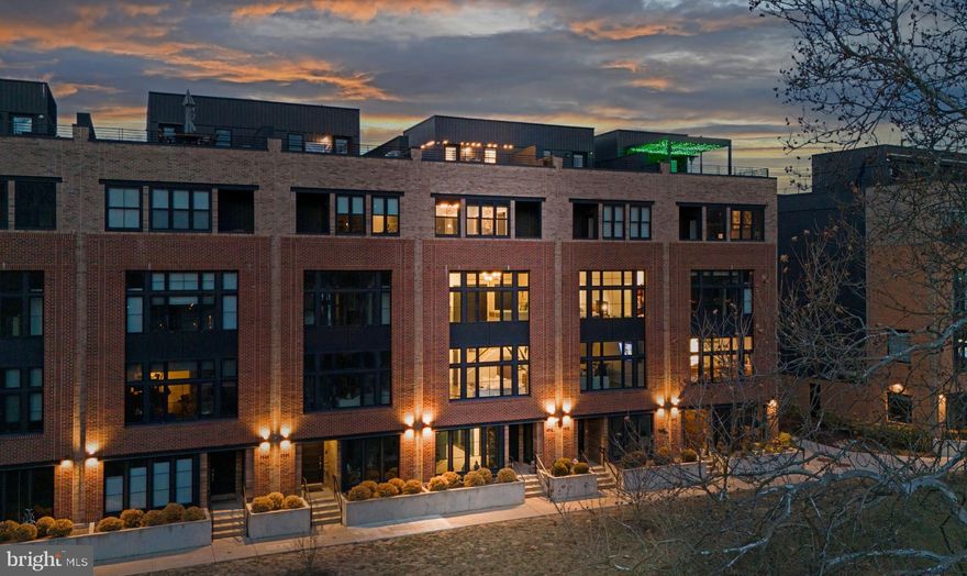 Welcome to Unit 4582, a masterpiece of modern luxury in The Locks at Manayunk, offering breathtaking, unobstructed river views and an effortless blend of elegance and convenience. Set within this premier riverside enclave, this townhome provides a tranquil retreat while placing you within easy reach of Main Street’s vibrant dining, the historic Manayunk Canal Path, and the train for seamless city access. Spend your day exploring Manayunk’s boutiques and restaurants, an end it with unforgettable sunsets from your private rooftop deck. Inside, sophistication meets smart living with four bedrooms, 3.5 baths, and a suite of high-end amenities, including a Savant smart home system, Lutron lighting and window treatments, a 4K ultra-HD projector, a five-stop elevator, and an integrated sound system. The sunlit first floor sitting area with custom built-ins and serene river views offers a perfect lounge space, while the expansive two-car garage provides ample storage. The main living area is designed for both everyday luxury and grand entertaining. Wall-to-wall windows flood the space with natural light, while the upgraded kitchen boasts custom shaker-style cabinetry, Wolf six-burner range, Sub-Zero refrigerator,  oversized quartzite island, walk-in pantry, and a built-in beverage fridge. The living area showcases stunning water views, enhanced by an ultra-HD projector and hidden theater screen, complemented by Lutron UV-blocking shades that adjust at the touch of a button. The third floor features a serene bedroom suite with fantastic river views, dual walk-in closets, and an en-suite bath. Two additional bedrooms—one currently a refined office—share a well-appointed hall bath, along with a convenient laundry room. The fourth-floor primary suite is a private sanctuary, complete with Lutron blackout shades, a spacious walk-in closet, two additional closets, and a private balcony overlooking the river. The luxurious spa-inspired bath boasts dual vanities, a marble walk-in shower, and a deep soaking tub, while a cozy sitting area and beverage center complete the suite. Atop it all, the spectacular rooftop deck with Ipe wood decking, integrated lighting, and a premium sound system delivers panoramic views of the Schuylkill River and Manayunk’s skyline. This home is situated above the floodplain, and flood insurance is not required. With four years remaining on the Tax Abatement, and a location steps from Main Street, the Schuylkill River Trail, and I-76, Unit 4582 isn’t just a home—it’s a lifestyle.