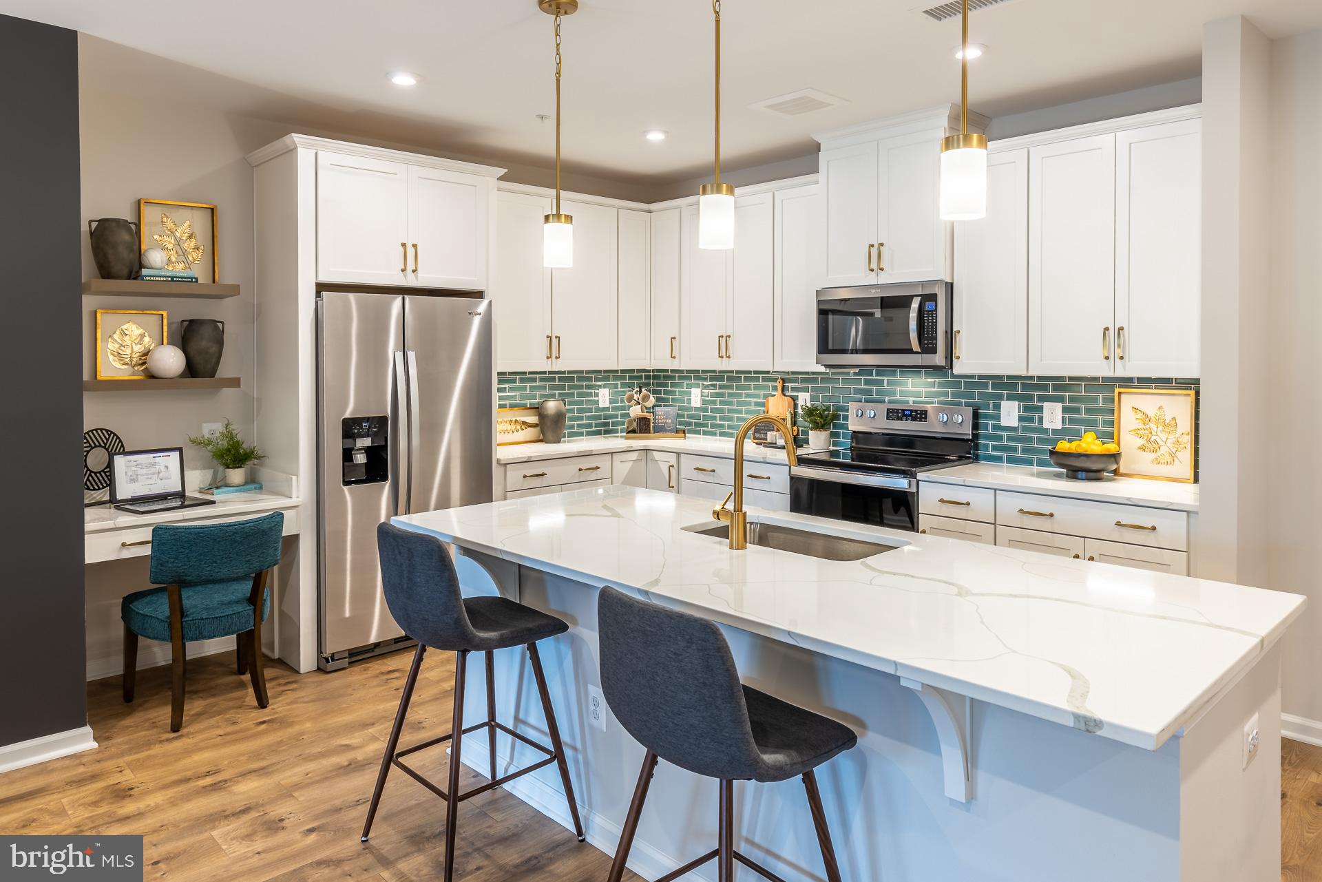 Find Your Perfect Fit at Gatherings at Cabin Branch. Whether you're looking to elevate, downsize, or rightsize your lifestyle, this 55+ community in Clarksburg offers the perfect balance of comfort and convenience. Choose from five stylish condo floorplans with elevator access and enjoy amenities like a billiards room, gym, golf simulator, and more. Join community events at the clubhouse or explore Clarksburg Outlets for shopping and dining. At Gatherings at Cabin Branch, you’ll be close to everything that matters most—daily conveniences, top-tier amenities, and cherished connections. Move-In Ready!!! This 55+ open-concept condo is located in highly-sought after Clarksburg, MD, at Gatherings at Cabin Branch! Enjoy over 1,500 sq. ft. of living space, including a spacious kitchen featuring a walk-in pantry and breakfast bar. The living room and dining area provide plenty of space for entertaining and grant access to each bedrooms, as well as the private balcony. The sizeable secondary bedroom offers a walk-in closet, where as the primary suite provides two closets and a spa-inspired bath with an oversized shower and seat! Included features: Elevator Access, 1-car garage, laundry package (washer and dryer), spacious kitchen island with center sink, designer hardwood flooring in select rooms, dual vanities in the primary bath. This home is rated Energy Series PLUS, meaning you receive enhanced construction features that deliver a tighter, more efficient home. In addition to being ENERGY STAR certified and Indoor airPLUS qualified, this home has higher performing low-e windows, HVAC equipment and ductwork in conditioned space, and more – saving you tons of money each month on utilities! ** Photos of the model home. *Pricing, features and, availability subject to change without notice. MHBR No. 93 2023 Beazer Homes.