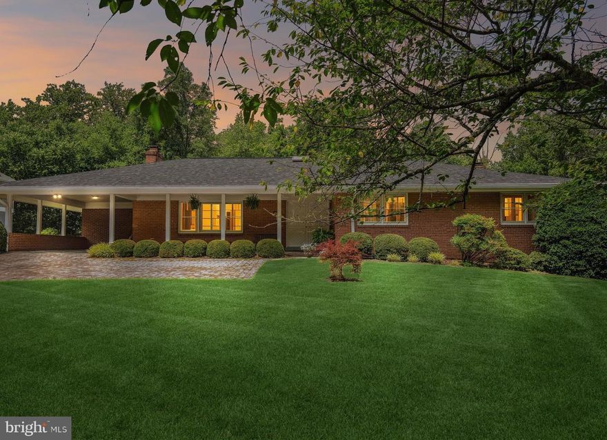 Wow, this is it!  A classic custom rambler in Luxmanor on an amazing almost half-acre level lot, with an inviting flagstone front porch -- on a private street with two cul-de-sacs!  This home has been lovingly maintained over 59 years of ownership, and boasts a nearly new roof and hot water heater, along with other upgrades.  This could be "the one."  From the sunlit foyer, courtesy of an oversized skylight, the home unfolds, with the living spaces on one side, and the three main level bedrooms on the other.  The elegant living room includes one of the two fireplaces in the home.  The formal dining room is perfect for gatherings of all kinds with views of the beautiful grounds.  Off the dining room is the sitting room/home office, with picture windows on two sides, again perfect to enjoy the abundant greenery outside.  The eat-in kitchen also has views of the outdoors, including a sliding glass door providing access to the huge deck off the back of the home.  On the other side of the foyer, there is an updated powder room, and then a hallway leading to the three bedrooms and two full baths, including the coveted main level primary suite.    Down the open staircase from the foyer to the lower level,  you'll find the perfect family room/rec room, replete with the throwback bar!  In another room, there is  space for a game table.  There is also a fourth bedroom, with its own door to the outside, a full bath,  a laundry room, a mechanical room, and a fifth bedroom or home office, perfect for a home based business, with its own door to the outside.  Speaking of outside, the grounds are just lovely, lined with trees, with plenty of space for Fido, for a playground and/or a backyard pool.  All of this, and so close to Pike & Rose, two Metro stations, Whole Foods, Starbucks, and so much more.  This one won't last!