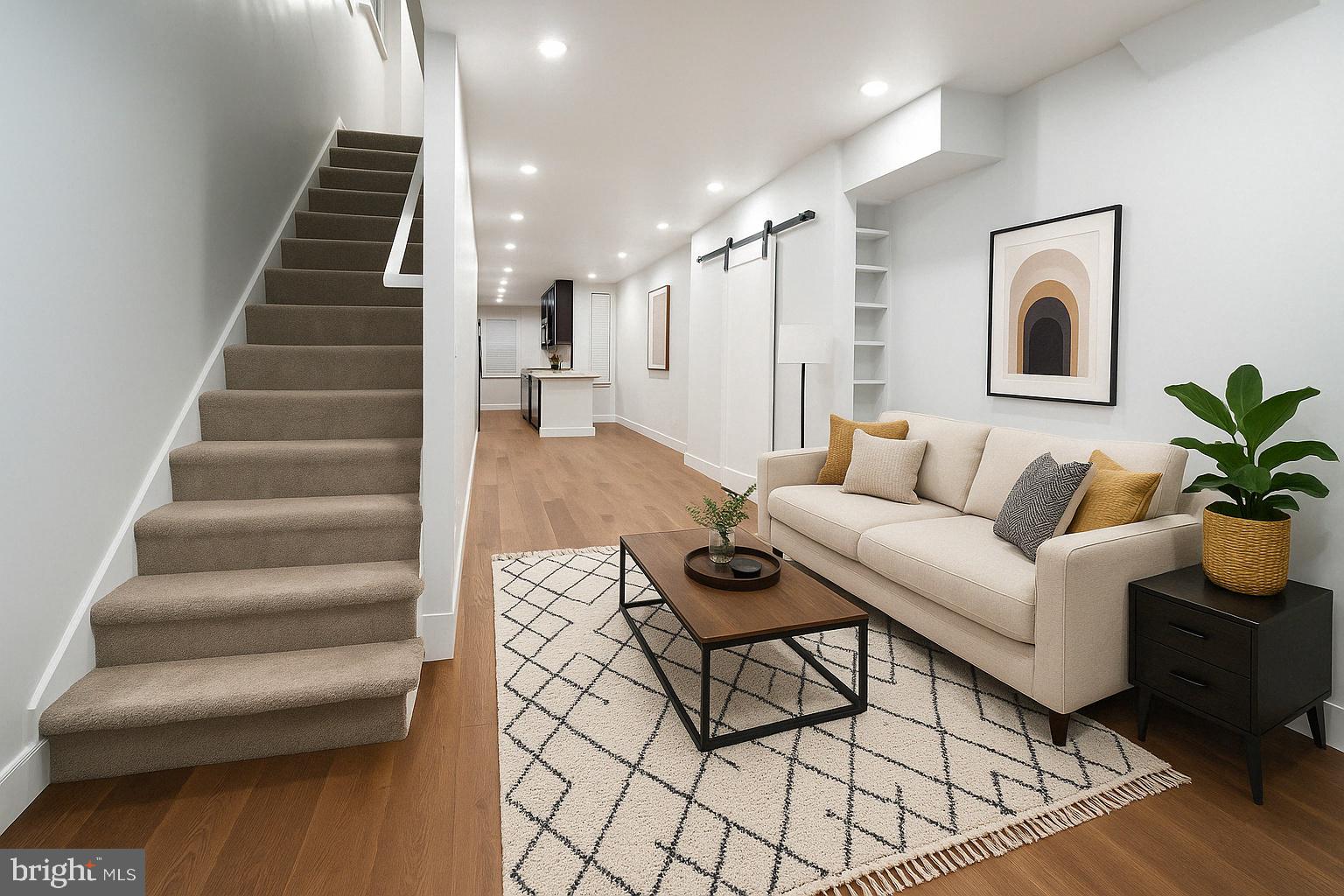 **Offering a $5,000 seller concession**
This beautiful, COMPLETELY remodeled 3-bedroom, 2-bathroom end unit townhome has been thoughtfully and expertly customized by a father-and-son team. Every detail has been carefully considered, with brand-new plumbing, electrical systems, HVAC, windows, hardwood floors, and wall-to-wall carpet throughout.
To add a unique touch, the homeowners commissioned local mural artist Bmore Smug to create a one-of-a-kind mural titled "St. George and the Dragon" on a prominent outdoor wall — a stunning addition that has become a neighborhood favorite.
Bright, airy, and filled with natural light, this home showcases exceptional craftsmanship, especially in the newly designed bathrooms and kitchen. The owners’ dedication to creating a beautiful and functional space is evident in every corner.
The new Greater Model Aquatic Center is being built right behind this house. See photos!
The house is close to Morgan State University and Johns Hopkins University.
*Staging photos are AI generated.*
