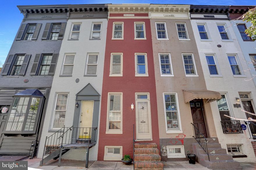 Welcome to 1306 Rutter Street, where historic charm meets modern comfort in the heart of Bolton Hill. This three-bedroom, one-bath brick home offers the perfect blend of character, light, and livability.
Step inside to discover exposed brick walls, warm hardwood floors, and thoughtful updates that celebrate the home’s original craftsmanship. The inviting main level flows seamlessly from the living area to a stylish kitchen featuring granite countertops, solid wood cabinetry, and stainless steel appliances—ideal for both everyday living and entertaining.
Upstairs, three bedrooms capture the home’s authentic charm with wood-beamed ceilings, painted brick accents, and ample natural light. The full bath is bright and modern, offering tasteful finishes and generous storage.
The lower level provides a partially finished front half and a utility room in the back of the basement —perfect for storage. Out back, a private brick patio surrounded by ironwork and greenery creates a peaceful escape, ideal for morning coffee or evening gatherings.
Located on a quiet block just steps from MICA, Penn Station, and Bolton Hill’s beloved cafes and parks, this home pairs historic architecture with urban convenience in one of Baltimore’s most sought-after neighborhoods.