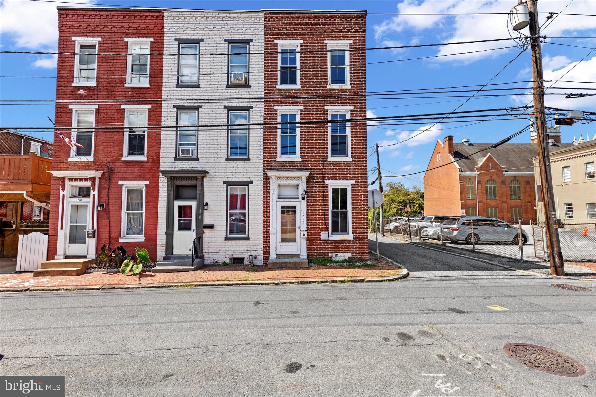 Move right into this 4-bedroom end-unit townhome in a prime Midtown location. The first floor showcases original hardwood floors and an exposed brick accent wall, with natural light filling the living spaces. The updated kitchen features stainless steel appliances, a drop in farmhouse sink, and subway tile backsplash, with direct access to a private enclosed patio.
Two bedrooms are on the second floor and two more on the third, along with a full bath on the second floor that includes a laundry area. Central A/C, newer windows, and thoughtful updates throughout make this home comfortable and convenient. All just steps from Broad Street Market, Riverfront Park, and downtown amenities!