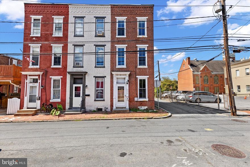 Move right into this 4-bedroom end-unit townhome in a prime Midtown location.  The first floor showcases original hardwood floors and an exposed brick accent wall, with natural light filling the living spaces. The updated kitchen features stainless steel appliances, a drop in farmhouse sink, and subway tile backsplash, with direct access to a private enclosed patio.

Two bedrooms are on the second floor and two more on the third, along with a full bath on the second floor that includes a laundry area.   Central A/C, newer windows, and thoughtful updates throughout make this home comfortable and convenient. All just steps from Broad Street Market, Riverfront Park, and downtown amenities!