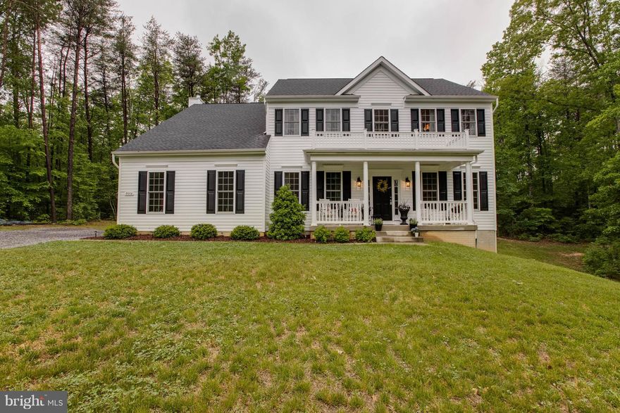 Meticulously Maintained Colonial situated on almost 3.5 acres minutes to the Spotsylvania VRE Station.  Featuring gleaming hardwood floors, 10' ceilings, large open floor plan, over 4000 square feet, 3 finished levels, familyroom off the kitchen has wood burning fireplace, formal living room, formal dining room with crown molding & chair rail, main level office with glass doors, Kitchen has granite counters, stainless steel appliances, farmhouse sink, lovely master suite with 2 walk-in closets, luxury master bath has garden tub & separate shower, double vanities, finished lower level rec room, 5th bedroom & full bath, 2 car sideload garage, composite deck, lots of trees, & much more.  Close to schools, shopping, I-95 & Route 17, & public transportation.