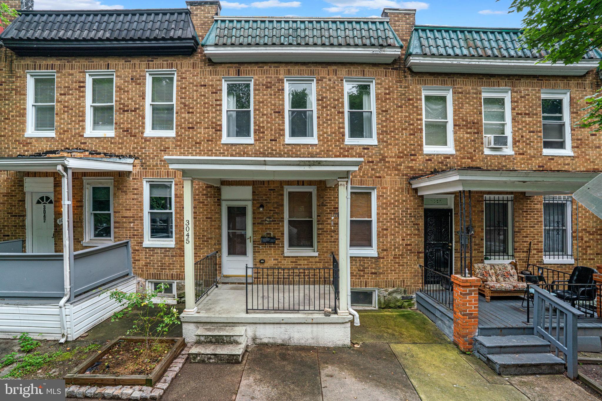 This 3-bedroom Baltimore rowhome is full of charm and modern updates! Step into a perfectly balanced living space that opens to the dining and kitchen area which are truly the heart of this home. Recently renovated with warm bamboo flooring and preserving traditional character with high ceilings and crown molding, this space also features gorgeous lighting, a striking backsplash wall of handmade tile, white cabinets, stainless steel appliances including a gas range, quartz countertops, and a center island that accommodates additional seating. A lovely half bath and additional storage closets for cleaning and pantry lead to the back porch and patio.
Upstairs, you'll find three comfortable bedrooms and a full bath in the hallway. Enjoy relaxing mornings on the inviting covered front porch and enjoy the central location just minutes from local hospitals and universities, and steps from shopping, restaurants, and the farmer's market.
Systems are in great condition with updated electrical, gas hot water heater, and basement waterproofing. The house also features central air and heat. This home combines charm, comfort, and convenience—don't miss the opportunity to make it yours!