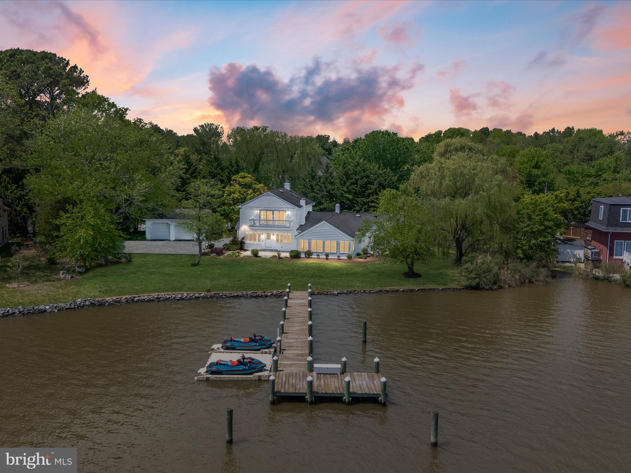 **Exquisite Waterfront Retreat on Chester River**
Welcome to 7961 Quaker Neck Road, Chestertown, MD – an elegant and modern sanctuary nestled on the coveted Chester River, offering a rare opportunity to own a completely remodeled waterfront property. This exceptional home encompasses five beautifully appointed bedrooms, four luxurious bathrooms, and sits gracefully on nearly half an acre of pristine land.
As you step inside, you're greeted by an abundance of natural light streaming through perfectly placed skylights, highlighting the breathtaking waterfront views. The main level features an expansive living room adorned with a cozy fireplace, seamlessly flowing into a chef's dream kitchen. This culinary masterpiece boasts an expansive island with seating for eight, upgraded cabinetry and countertops, a deep farmhouse sink, and top-of-the-line stainless steel appliances, including two dishwashers, two wall ovens, a gas range, microwave, refrigerator, and a wine fridge. Every detail has been meticulously crafted to showcase the stunning water views.
The adjoining sunroom offers a serene space to unwind, while the recreation room provides ample space for entertainment and leisure. The main level also includes three spacious bedrooms, one with an ensuite, and an additional full bathroom. Upstairs, discover two more bedrooms, each with its own en suite, and a primary bedroom that features expansive windows and access to a private deck, perfect for savoring the tranquil water views.
Outside, the peaceful backyard beckons you to relax and enjoy the serene beauty of the Chester River. A recently constructed dock, less than three years old, provides easy access to the water, while two outdoor showers offer convenience after a day of river adventures. The large detached garage ensures ample storage space for all your needs.
This home is enhanced by a range of modern upgrades, including newer windows, skylights, and doors, all completed in 2022, along with freshly painted exteriors and a Rinnai water heater. Three working fireplaces, two wood-burning and one gas, create inviting spaces to gather on cool evenings. Additional amenities include a whole house generator, two whole house dehumidifiers, and a fully remodeled interior designed for ultimate relaxation and enjoyment.
Located just minutes from Historic Chestertown, this property allows you to enjoy the charm of small-town living with access to a variety of shops, coffee houses, and bakeries. Experience the perfect blend of elegance and modern comfort in this meticulously curated waterfront retreat. Homes like this are truly a rare find.