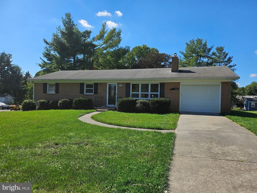 Location, Location. Brick Rancher offers Walkout Basement, 4 Bedrooms, Two Full Baths. Hardwood Floors throughout. Front Entry Ceramic Tiled. Kitchen Luxury Vinyl Floor, New Dishwasher,Disposal, Refrigerator with Ice-maker( Not Hooked Up) and Electric Range.  Basement Partially Finished with Brick Fireplace with Timberline Wood Stove Insert,  Fourth Bedroom, Laundry and Storage Area. Rear 15x12 Concrete Patio of Garage. Large Back Yard with Chain-link Fencing. Two Outbuildings for Storage. One Car Garage with Concrete Driveway.