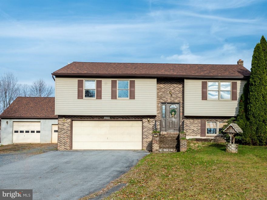 Move in ready 3 BR home with 2 Full baths on a 1 acre lot. Features kitchen, dining and living room with an open floor plan, laminate flooring and freshly painted. Inviting lower level family room with a wood/coal stove, 2 storage closets,  and door to 2 car garage. Additional 2 car garage is is perfect for the hobbyist -detached, heated and has storage space above.  The 1 acre lot provides space and privacy with a rural setting. Book your showing today!