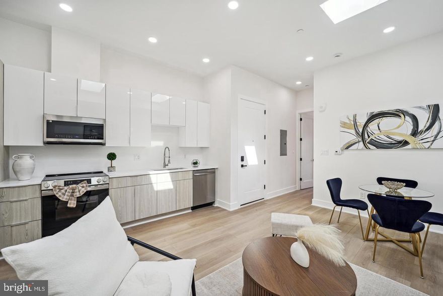 LOW CONDO FEE! Welcome to 705 Quincy St NE #6—a stunning residence in a brand-new boutique building, perfectly positioned near all the best that DC has to offer! This thoughtfully designed home showcases high-end finishes throughout, including wide-plank engineered hardwood floors, striking custom lighting, and oversized windows that flood the space with natural light while offering charming neighborhood views.  Inside, you'll find an open-concept layout ideal for modern living and entertaining. The spacious living and dining areas seamlessly connect to a sleek, contemporary kitchen featuring quartz waterfall countertops, European-style cabinetry, and a premium stainless steel appliance suite.   The home includes two generous bedrooms, each with ample closet space, and two full bathrooms adorned with designer fixtures and finishes. All this, plus the convenience of being steps away from local restaurants, shops, parks, and public transit.  Don’t miss your chance to own this exceptional home in one of DC’s most vibrant neighborhoods!