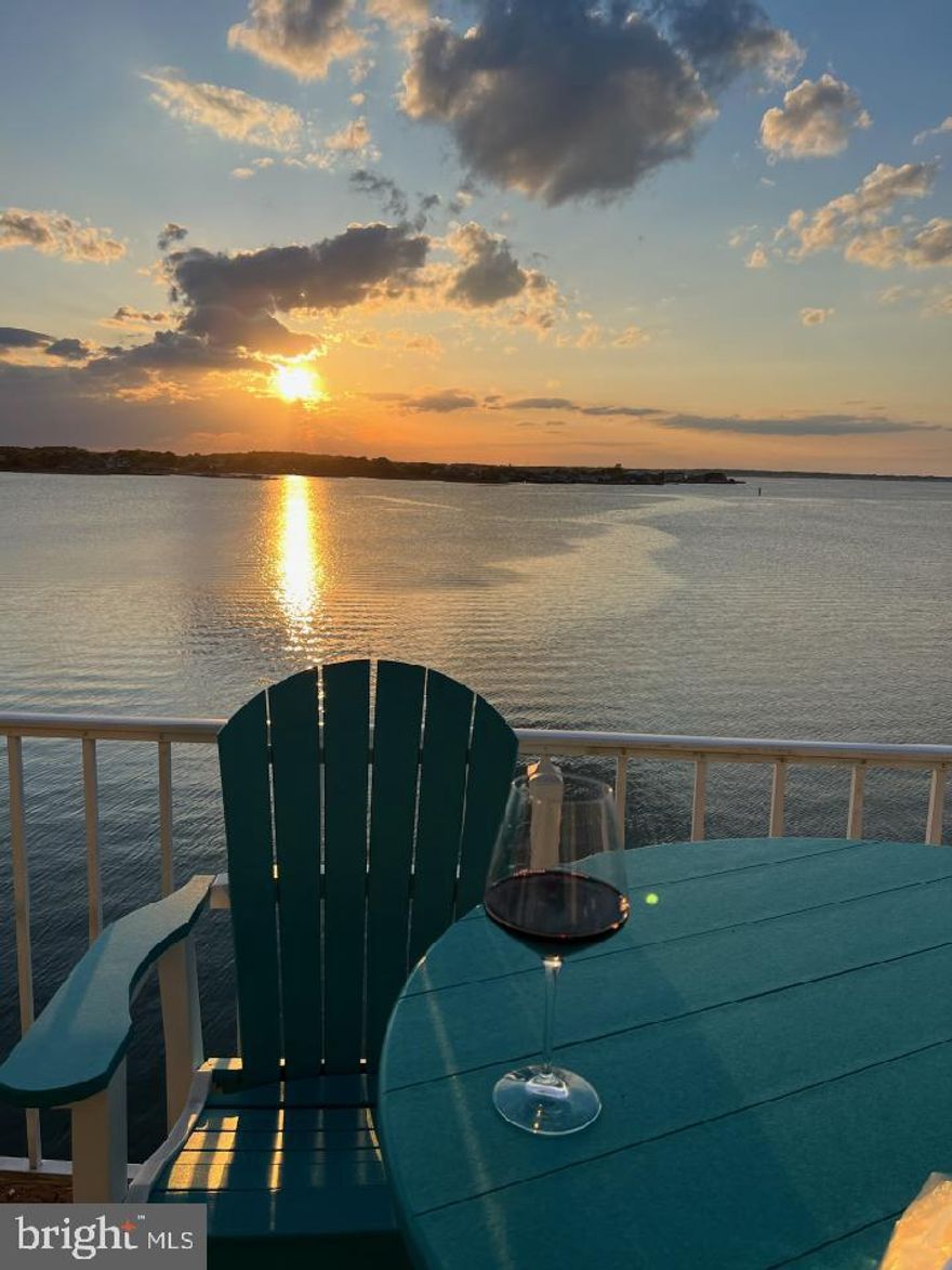 Enjoy Spectacular Views from Your Very Own Bayfront Condo in one of the best waterfront communities in OC – Your Dream Retreat Awaits! Discover the ultimate coastal living experience at the M Building of the world-renowned Harbour Island! Owners didn't rent, but GRI would be awesome (especially with White Marlin Week!) - estimated GRI is $30,000-$45,000. This top-floor 2 bed/2 bath condo is a true gem, offering direct bayfront access and breathtaking views that will take your breath away. With its spacious layout and abundant natural light, this condo is perfect for those seeking a tranquil escape. Open Living Space with Panoramic Sunsets - Step inside to an inviting open living area, featuring double sliders that lead to a generous balcony. Enjoy the best panoramic sunsets in town while overlooking the stunning bay—perfect for relaxation or entertaining guests. The updated kitchen is equipped with granite countertops and stainless steel appliances. It seamlessly flows into a large dining and living area, creating a serene, zen-like atmosphere ideal for gatherings. Retreat to the primary ensuite, with a completely renovated to include a stunning custom walk-in shower, a spacious vanity, and a smart mirror that adds a touch of elegance. The hall bathroom has also been tastefully updated for your convenience. Recent improvements ensure a move-in ready experience, including new bedroom windows (2024), a new washer/dryer (2022), a new range (2022), and a storm door (2022). Harbour Island is a boater’s paradise, famously hosting the annual White Marlin tournament. Residents enjoy a wealth of amenities, including a gorgeous pool, pickleball and tennis courts, and a tot lot for children. Plus, you’re just steps away from the popular Reel Inn restaurant! Condos in this sought-after gated community are highly desirable -Don’t miss your chance to own this coastal sanctuary—schedule your appointment today and find your new happy place by the OC beach! Embrace the lifestyle you've always dreamed of in this spectacular bayfront condo!