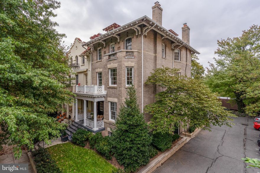 SUBSTANTIAL PRICE IMPROVEMENT! $150,000+ REDUCTION! NEW LISTING in Woodley Park! Welcome to the extraordinary residence of 2615 Woodley Place, NW in the heart of Woodley Park. This grand, approximately 6,000 square feet, four story brick Wardman residence  was built in 1909-1910.  It is truly one of the largest and most special homes in Woodley Park as it is semi-detached with three exposures. It is also an entertainer’s dream come true. One of  many very special features is that the south and east elevations overlook the treetops of Rock Creek Park. The home has been meticulously maintained and lovingly renovated while expanding the interior living spaces. There are numerous architectural elements and original features of this grand residence still in tact.  Upon entry, one is immediately captivated by the grandeur of the Entrance Hall and views to the ornate staircase. To name a few extraordinary features, the ceilings are approximately 11 feet and adorned by ornate crown molding. The residence also boasts original parquet and hardwood floors. There are 4 fireplaces, original hardware and many special details throughout. The expansive Living Room boasts a fireplace and glorious windows looking onto the front garden and the tree-lined street below. The Dining Room features a fireplace surrounded by onyx, a splendid and original coffered ceiling, original wood paneled walls and beautiful pocket doors leading to the Living Room. On the main living level, there is a gourmet eat-in Kitchen with professional grade appliances including a 15-rack wine refrigerator, honed marble counters, and an abundance of cabinets and cupboards.  Also on this main living level, there is a charming Family Room with access to a limestone patio and a powder room. There is also a rear staircase from the Kitchen to the Second Floor. The Second Floor features an expansive Primary Suite with a sumptuous en suite bath, a fireplace, two large windows facing south, and two grand dressing rooms.  There is also a hall bath, a fantastic paneled Library and Guest Bedroom on this level. The 3rd flood consists of 2 more guest bedrooms, an expansive Family Room, a hall bath and a wonderful serene and picturesque screened-in porch overlooking the treetops of Rock Creek Park. The Lower Level has an in-law suite with separate access and a full bath as well as a kitchen, laundry room, large cedar closet, two-car garage plus an additional interior garage. This residence is completed by surface parking for an additional 5-6 cars in the rear.