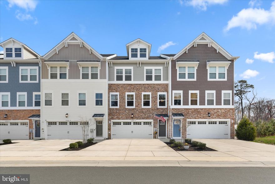 Welcome to 12428 Sea Oaks Lane, #5, an exceptional three-level townhome offering a rare combination of space, style, and coastal convenience. Unlike many four-bedroom townhomes that span four levels, this residence is thoughtfully designed across just three, featuring a highly desirable first-floor bedroom complete with a private ensuite bath, an outstanding and hard-to-find feature. 

Conveniently located in West Ocean City, this four-bedroom 3.5 bath home is just one mile
from the West Ocean City Harbor boat ramp and moments from local dining favorites and
shopping. You will also appreciate easy access to Ocean City Beach, the iconic Ocean City
Boardwalk, charming downtown Berlin, and the natural beauty of Assateague Island.

Inside, a soothing neutral palette, luxury vinyl plank flooring, and detailed crown molding create a cohesive and inviting atmosphere throughout. The gourmet kitchen is a standout, showcasing high-end finishes, quartz countertops, a stylish backsplash, and soft-close cabinetry. An expansive island, complete with a built-in microwave and dishwasher, anchors the space and provides the perfect setting for entertaining or casual dining. Additional highlights include a cooktop with range hood, double wall ovens, and a spacious walk-in pantry. The kitchen flows seamlessly into the dining area, where sliding glass doors open to an elevated balcony overlooking a private, tree-lined backdrop.  

The main level also features a convenient powder room and a dry bar, ideal for hosting. Upstairs, the primary suite offers a double-door entry, a generous walk-in closet, and a well-appointed en suite bath with dual vanities, a frameless glass shower, and built-in bench seating. Two additional bedrooms, a full hall bath, and a dedicated laundry room complete the upper level.  

The entry level expands the home’s versatility with a comfortable sitting area, a fourth bedroom with its own en suite bath and walk-in closet, perfect for guests, a mudroom, and access to the finished garage. From here, step outside through the atrium door to a beautifully designed paver patio with steps leading to the fully fenced backyard, where wooded views provide a sense of privacy rarely found in town home living.  Enjoy a community pool and playground.  Don’t wait, schedule your viewing appointment today!