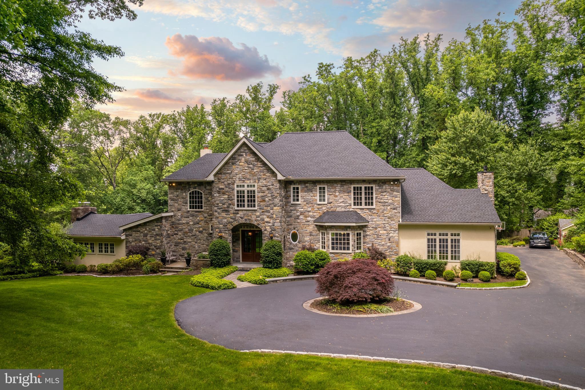 Look no further! An absolutely stunning home sitting on a gorgeous 2+ acres with a large heated pool, in a most private setting, is here just in time for the glory days of summer. Hidden from the road, but greeted by a cobble lined circular driveway you'll find a custom stone front beauty that will both surprise and delight. A total renovation completed in 2008 includes a new addition that effectively doubled the home in size. The new addition has 10' ceilings on first floor and 9' ceilings on the second. Its gracious center hall with turned staircase looks directly into a beautiful formal dining room and just beyond the sweeping stairs is a step-down LR with stone fireplace, vaulted beamed ceiling, and doors to a patio overlooking the pool. The kitchen is a chef's dream, with a large center island, Dacor double ovens and 6 burner gas range, 2 DW's, a separate Sub Zero refrigerator and freezer, an ice maker, Viking wine refrigerator, and a large eat-in breakfast area. Just off the kitchen is a sun filled family room with gas fireplace. A walk-in pantry, laundry room, and mud room with entrance to the fully decked out 3-car garage complete the first floor. This home's unique and flexible floor plan is just right for today's work from home life style. You'll find 4 bedrooms and 3 full baths, on one side of the house and a 2 story owners' wing on the other featuring the main bedroom with Juliet balcony, a marble bath, dressing area and a large walk in closet plus 2 offices, one with fireplace, and a full bath on the floor below. The lower level of the house offers lots of places to play or relax, featuring a multi-media room with wet bar, a game room/cabana with powder room that leads to the pool via covered porch. Worried about your Peloton? There is an extra-large unfinished storage area that's big enough to share with your home gym. This pristine move-in ready home with new roof and gutters, new multi-zone HVAC, new hot water heaters in 2020, an automatic generator that accommodates 95% of the house, a security system, irrigation system, extensive landscaping that blooms all summer, a POOL, and so much more, is just waiting for you to fall in love. Blue Ribbon Upper Dublin School District, steps from Manufacturers Golf Club and minutes to Rt 309 and the PA turnpike make this location a TEN.