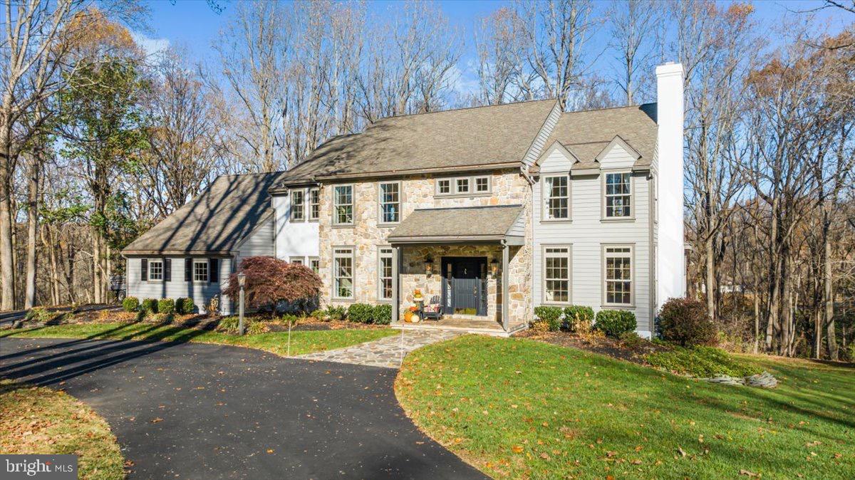 Welcome to a peaceful retreat in the award-winning Unionville-Chadds Ford School District! Nestled on a private one-acre lot at the end of a tranquil cul-de-sac in Waterglen, this stunning home features all new Anderson windows and sliding glass doors. The home combines the charm of a classic Pennsylvania farmhouse with thoughtful updates and modern comforts. Built in 1990, its stone, cedar, and stucco exterior welcomes you into a warm, light-filled interior where timeless details meet today’s conveniences.
The open main level is the heart of this home, featuring beautifully refinished hardwood floors, and elegant crown molding and wainscoting throughout. The spacious kitchen is a chef’s dream, with Subzero appliances, a Thermador cooktop, granite countertops, and a gorgeous marble backsplash. An adjacent eat-in area opens directly onto the massive deck, stretching over 50 feet and overlooking private, wooded views—perfect for outdoor dining, relaxing, and endless entertaining.
The main level also boasts a cozy family room with a vaulted ceiling, built-ins, and a stunning stone fireplace, along with a formal dining room and an open study equipped with custom bookcases and a charming window seat. Upstairs, you’ll find five bright, comfortable bedrooms, including a luxurious primary suite with a spa-like marble bathroom and a custom walk-in closet. Each room is designed to capture natural light and scenic views.
A finished basement offers even more space for hobbies, work, or play, with areas for a home office, rec room, or crafting. Outdoors, lush landscaping and a natural gas hook-up for your grill make the backyard a perfect spot for gathering with friends and family. Plus, this home’s West Chester location gives you quick access to fantastic shopping, dining, and parks while enjoying a private, neighborhood feel.
With its spacious design and upscale details, 1662 Waterglen Drive is a true sanctuary—a place to relax, entertain, and make lasting memories. Welcome home!