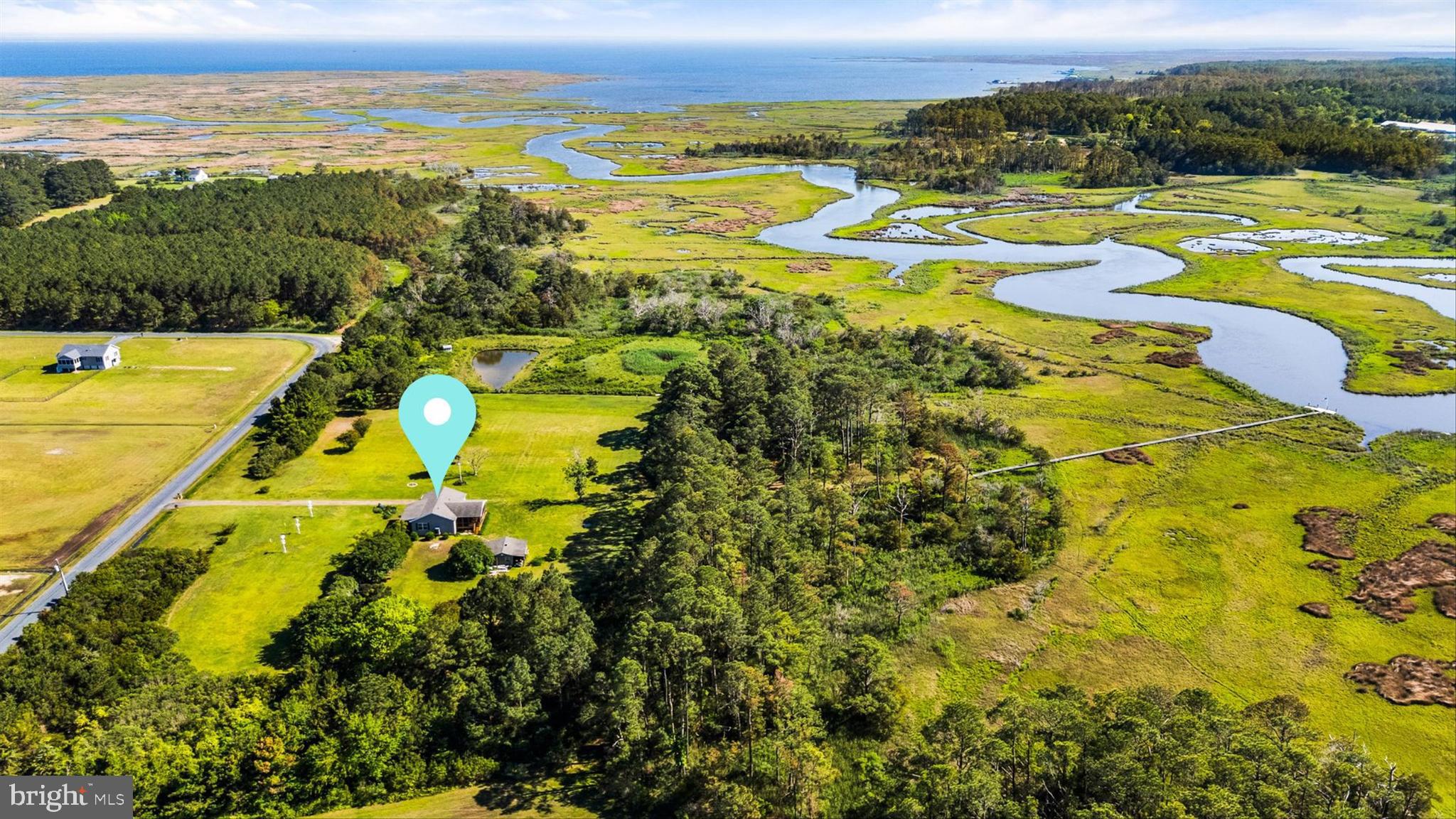 Attention fishing, crabbing, boating and hunting fanatics! Rare opportunity to own the quintessential Eastern Shore lifestyle on this 29.6-acre waterfront estate. Step out of the hustle and bustle of life, into your own private oasis. This one of a kind property offers a world of outdoor adventures, from duck and deer hunting to fishing and crabbing from your own private wharf, where you can tie up your boat and set out on the water whenever you please. The property also features a private saltwater pond teeming with wildlife, and regular sightings of majestic blue heron, wild turkey and white egrets. Additionally, a separate workshop with electric and ample storage for a golf cart, boat, and all your outdoor gear . A true waterman's and hunter's dream.
Lovingly maintained, the home boasts 3 spacious bedrooms and 2 bathrooms, including a primary suite with a full ensuite. Relax and unwind on the massive screened porch, perfect for savoring the gentle breezes and gorgeous sunsets on peaceful Eastern Shore evenings. Properties like this are rare! This is your chance to experience what true Eastern Shore living is all about.