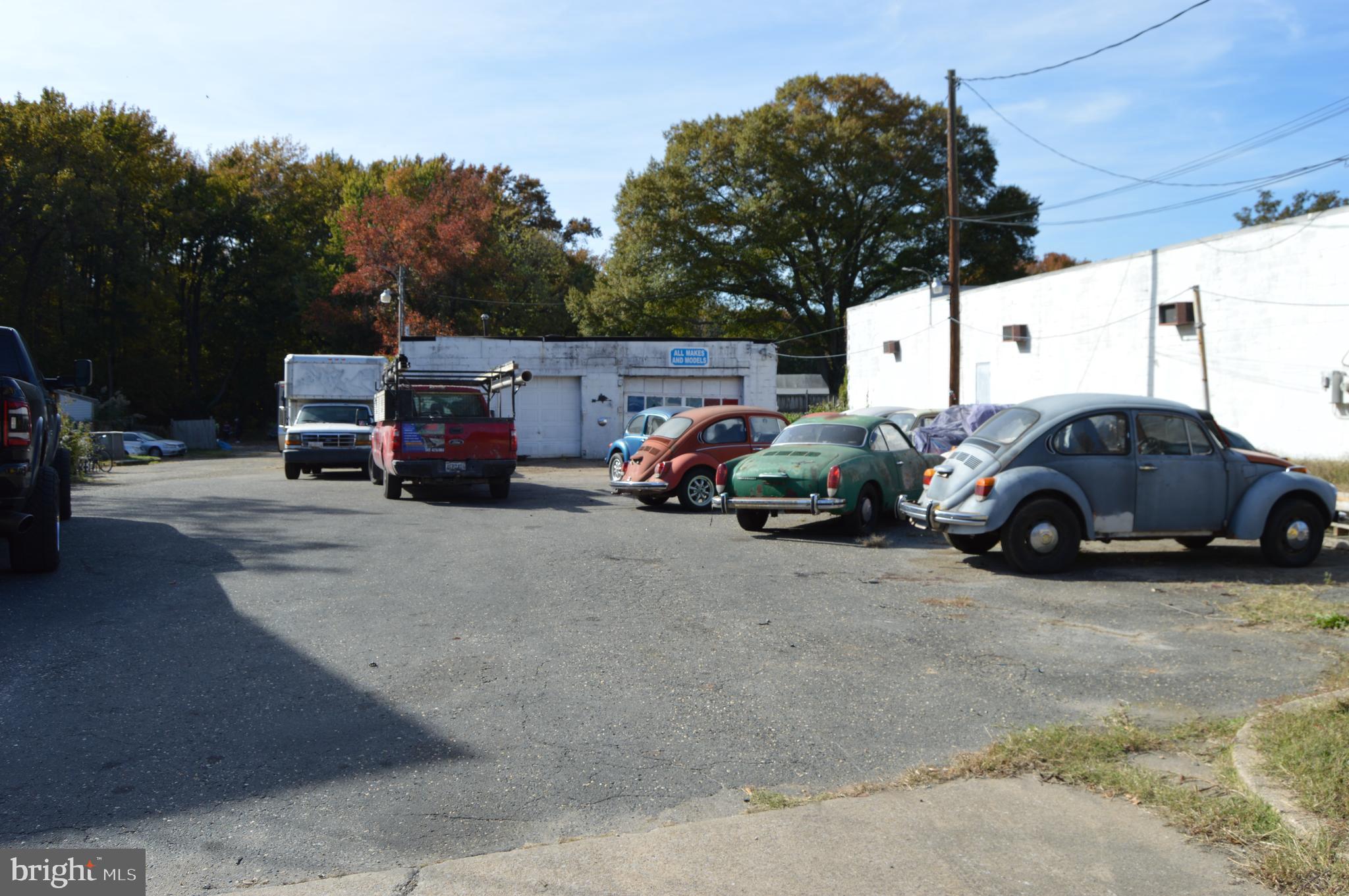 ​​​ The 2 bay garage is 30 feet deep and has 12 feet of clearance inside.​ There is a small office and a bathroom in the garage also.​The house is 2000 sqft.​ with 3 bedrooms and 2 baths and could be office space, or made into living quarters for employees.​ There are 3 parcels that make up this property which is +/- an acre. This property is zoned W-3 with a non-conforming C-4 use