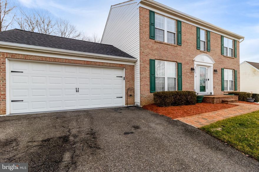 Plenty of room to grow in this 4-bedroom, 2 full baths, 2 half baths colonial home! When you move here, you won't need to move again. As you walk up to the home, beautiful hardwood floors throughout every level welcome you. Step into an open foyer with a dining room on one side and a living room on the other side before heading into the kitchen.  The eat-in kitchen is complete with granite countertops, stainless steel appliances, a pantry, and a beautiful backsplash.  The cozy family room has a ceiling fan and large windows bringing in natural lighting. Escape to the spacious owner suite with a ceiling fan, large walk-in-closet, and adjoining owner's bath including two vanities, tub/shower combo. Three additional bedrooms, and, full bath await upstairs. The basement is perfect for additional living space as you head down the custom-designed wood stairs you are greeted with a beautiful built-in waterfall fixture that leads to a recreation room with, half bath (with a rough-in to add a bathtub/shower), recessed lighting, laundry room with a laundry sink, and lots of storage. (the storage cabinets and bar do not convey) Entertaining outside is easy on this beautiful flat lawn. The quarter-acre back yard backs up to private trees.  Professionally painted and immaculate.  You won't believe it until you see all that this home offers. Don't miss this one!