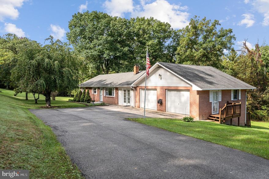 Well loved all brick rancher on 3 1/2 acres unrestricted acres .   One level living, close to Capon Bridge and close to town.   Front's on  a state maintained road.    All usable land mostly open some wooded.    Architectural shingle roof, newer Heatpump, woodstove, hardwood floors.    Lot's of garage space.   Covered and uncovered private outdoor sitting space.    This is a real gem.    Paved driveway.    Main level garages and lower level garage.   Several sheds.   Easy access.    This home offers great space on both levels.
The lower level rooms do not have egress windows but can likely be installed fairly simply if the next owner wishes to do so.   Bedroom/ Den/ Office / Craft / Exercise rooms.  There is a walk out exit located in the basement.  
The town of Capon Bridge offers The River House/music and art / community space, Farm to Table Butcher, the Farmer's Daughter, Library, Music Studio/school, a few restaurants, post office, dollar store, schools and churches.  Public River access to beautiful clean CaCapon River.   30 minutes to Winchester Medical Center, Walmart and Tractor Supply.