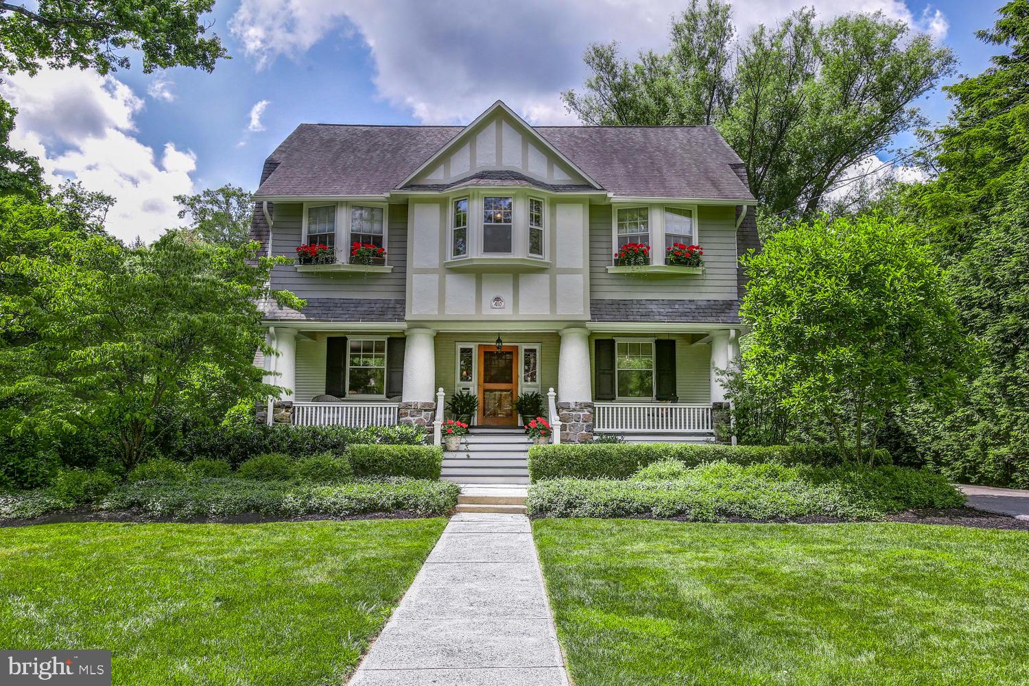 Standing along one of the most fabulous streets in South Wayne is this elegant and luxurious residence. Peaceful and private living is assured along with the convenient "walk to Wayne" setting. Close to shopping, restaurants and schools, you can't find a better location. A freshly painted exterior, overflowing window boxes, picturesque yard and covered front porch set the tone for this beautifully presented home. You'll enjoy summer nights reading on the porch swing and taking in the community as your neighbors ride by on their bikes and walk their dogs. Inside, you can take your pick from a host of living spaces that are spread throughout the 4,400 square foot layout. Plus there's an additional finished walk out basement. Five bedrooms and 4.5 baths service the home including the master suite. This is a wonderful haven complete with a dressing area and a reading nook, along with upgraded California closets. The modern master bath is also well-appointed with a double vanity, a soaking tub and a separate shower, promising the ultimate in relaxation. Cooking will be a pleasure in the gourmet kitchen with stainless steel appliances, granite counters, gorgeous cabinetry and an open-concept design with a light-filled breakfast nook. Step down into the two story family room with tray ceiling, fireplace and recessed lighting. Sliders create a seamless connection between the family room and patio, where you can dine with family and friends while overlooking the sparkling in-ground pool and private park-like surrounds. Endless hours of fun await all ages in the finished basement with a game room/workout area, craft room and wine cellar. There's also direct access to the yard and pool and the added full bathroom makes life so much easier. The long list of must-have features also includes a highly sought-after 2 car garage, two laundry rooms and side-access to the mudroom. This truly impressive home is perfectly positioned close to top-rated Radnor schools and is only minutes from the train, Blue Route and Schuylkill Expressway. Cafes, dining options, vibrant night spots and a movie theater are also within easy reach along with parks, gardens, renowned golf courses and hiking trails just waiting to be explored. This is a must-see home. Schedule your private showing today.