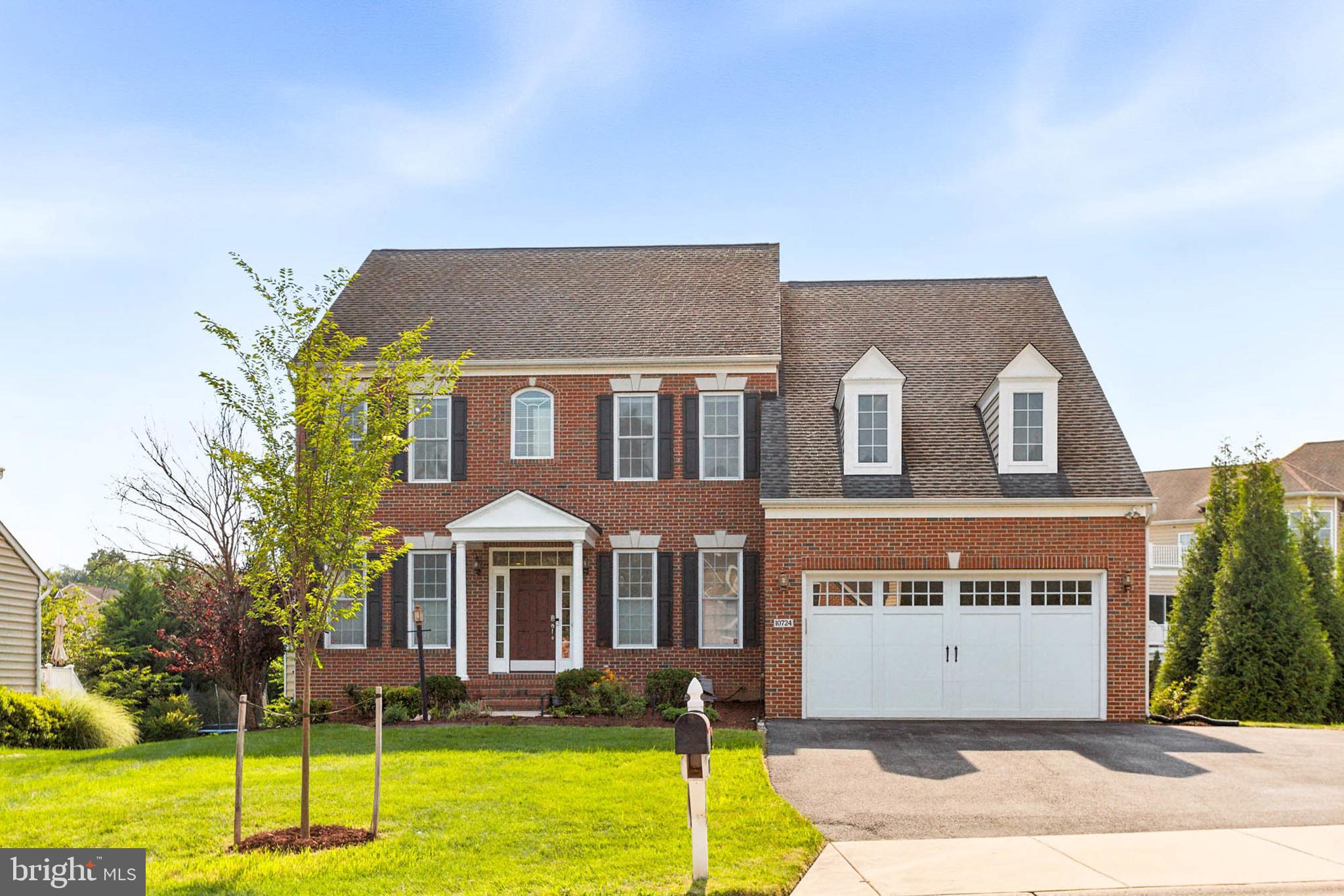 Come home to this big and beautiful 5 bedroom, 5 full bathroom transitional home in the coveted and rarely available Taylor Preserve neighborhood of Woodstock * Enter the bright and open foyer with hardwood flooring that extends throughout the entire main level * The open living room and dining room are on either side of the foyer and flow into the large gourmet kitchen with adjoining two-story family/great room with gas fireplace and the breakfast room with seating for up to 10 * The gourmet kitchen features long granite counters, handsome wood cabinetry, wall oven/microwave, gas cooktop with large vent hood, pantry, and breakfast bar * A slider in the breakfast room leads to the eze-breeze screened porch and large deck with composite decking and wrapped vinyl railings * The flexible main level bedroom can be used as an in-law suite, home office, or playroom * A mud room with front-loading washer/dryer set leads from the kitchen to the 2 car garage with included electric car charging station * The upper level includes 4 bedrooms and 3 full bathrooms including a primary suite featuring a large walk-in closet and super bath with separate soaking tub, dual vanities, and water closet * The finished basement features a recreation room with full bathroom and slider to the lower level brick patio and backyard * The unfinished basement area has ample room to add a future bedroom, movie room, or anything you can imagine for your active lifestyle * Custom top-down-bottom-up blinds and neutral paint throughout * Close to Waverly Woods and Turf Valley shopping and restaurants *