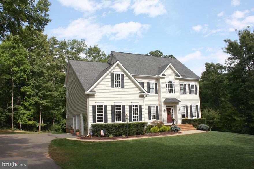 AGENTS CALL FOR ALARM TO BE DISARMED BUT NO MORE 24 HR NOTICE REQUIRED:  2.6 acres lot.: 2 story foyer  open floor plan; high ceilings throughout including basement; LG MBR w sitting area, 2 walk-in closets; formal LR and DR; study/den;  FR; gourmet kitchen w butler's pantry; 2 decks off rear;  finished WO basement (5TH BR) PERFECT  FOR IN-LAW SUITE. "rain-soft water sys"  AC  air scrubber/humidif