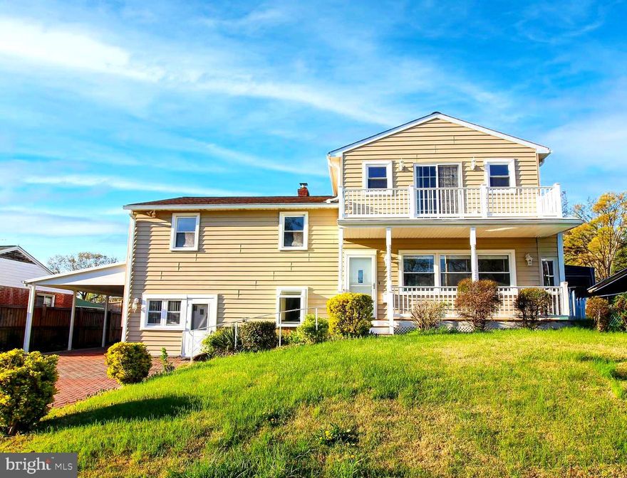 Welcome to this beautifully renovated split-level home, where modern comfort meets timeless charm.  This home has five spacious bedrooms and three full bathrooms, providing ample space for relaxation and entertainment. The main level of the home has an inviting open floor plan that seamlessly connects the family room to the kitchen, perfect for gatherings and everyday living. The kitchen is newly updated and features granite countertops and a cozy table space that invites casual dining. Newly refinished hardwood and luxury vinyl plank flooring flow throughout. Retreat to the huge primary suite which occupies it's own upper level of the house. The en-suite bathroom provides a spa-like experience with two toilets and double sinks. In addition, the primary suite has access to a private rear balcony and a front balcony as well. Ideal for morning coffee or evening gatherings under the stars.   On the first upper level there are 3 spacious bedrooms and a full bath ensuring comfort and privacy for all. The lower level has a bedroom space with a full bath and separate entrance perfect for an in-law suite or whatever you choose to make it.  The 2025 renovation has elevated the property with updated features that cater to a modern lifestyle of comfort and convenience.  Outside, the yard is complemented by a brick driveway leading to an attached carport, providing both functionality and curb appeal.  With its blend of modern amenities and classic design, this home is a sanctuary that promises comfort, style, and a sense of belonging. What a great place to call HOME!