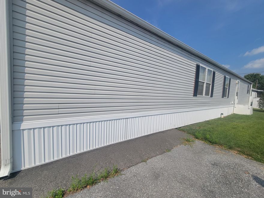 Open concept living in this 2000 Pine Grove model, 2bed/2bath, single wide mobile home. Brand new roof! Central air! Lovely enclosed front porch. This bright home also has an 8x10x7 storage barn for extra storage. All appliances including washer and dryer (both 2018) will stay.  Lot rent is $500/month and includes water, sewer, trash, snow removal. MUST be park approved. This is a tidy home in the Hi-Point Community, a quiet park within minutes to CVS, Walmart, Shopping and Shepherd Hills Golf Course. Seller needs 1-2 weeks after closing to move out.