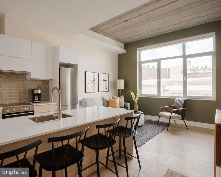 Welcome to Unit 207 — a modern 1-bedroom apartment that makes city living feel easy, comfortable, and just a little elevated. Designed with today’s lifestyle in mind, this space is ideal for those who want to work, relax, and recharge all in one place.

The open layout makes the most of every square foot, with oversized windows bringing in tons of natural light. The kitchen is sleek and functional with quartz countertops, stainless steel appliances, and plenty of cabinet space — whether you’re making a quick breakfast or hosting a casual dinner with friends.

The bedroom has enough room for a queen or king-sized bed and includes a built-in wardrobe closet. The bathroom feels like a personal retreat with extra storage, a deep soaking tub, rain-style showerhead, and full-size in-unit laundry — a real bonus.

This building was built with attention to quality and quiet—triple-pane windows, sound-dampening construction, and remote-controlled shades make it feel more like a high-end condo than a typical rental.

You’re right in Old City, surrounded by great coffee spots, unique shops, and some of Philly’s best dining. Getting around is easy too, with public transit and major roads close by.

Coming soon: rooftop terrace, fitness room, and bike storage to round out the lifestyle perks.
Limited On-site parking is also available for $315/month (limited availability).
Shirt term lease option available at different rates. Some furnished options also available. Inquire for availability.