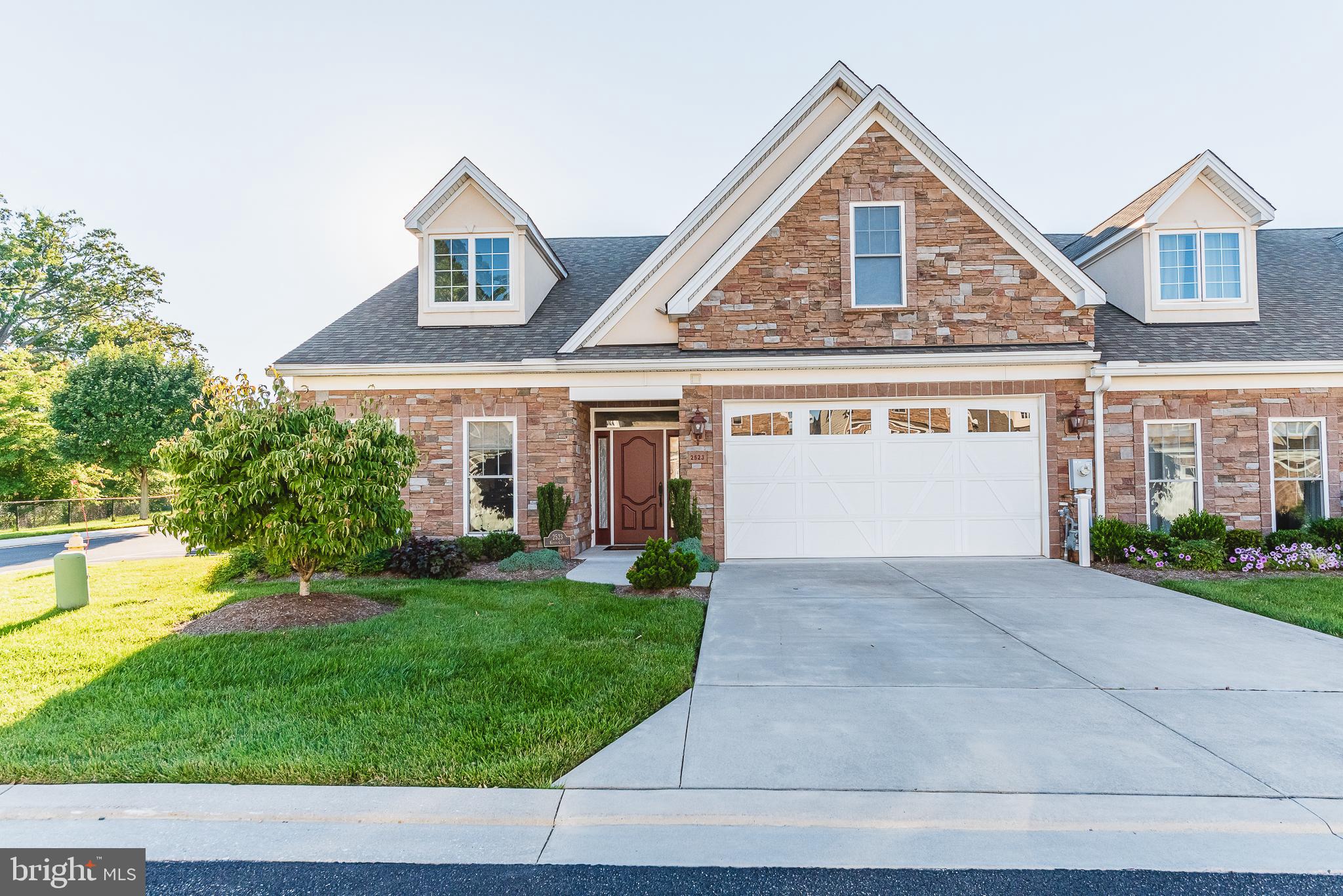 Welcome to 2523 Kenna court, a beautiful villa in the desirable 55+ Bentley Ridge Community. There are dual primary suites, on the main and upper levels. This home also features an open floor plan with a gas fireplace in the large living room. The exquisite eat-in kitchen has 42-inch custom cherry cabinets, double oven and double sink. The formal dining room has moldings and gorgeous hardwood floors that also cover much of the main living area. Upstairs, you'll find more bedrooms along with a versatile loft area. The home has plenty of storage along with a two-car garage. Overflow parking is close by for guests and you can enjoy a common area with gazebo. This home is owned as condo so the exterior maintenance is covered! Relax and enjoy this move-in ready home.