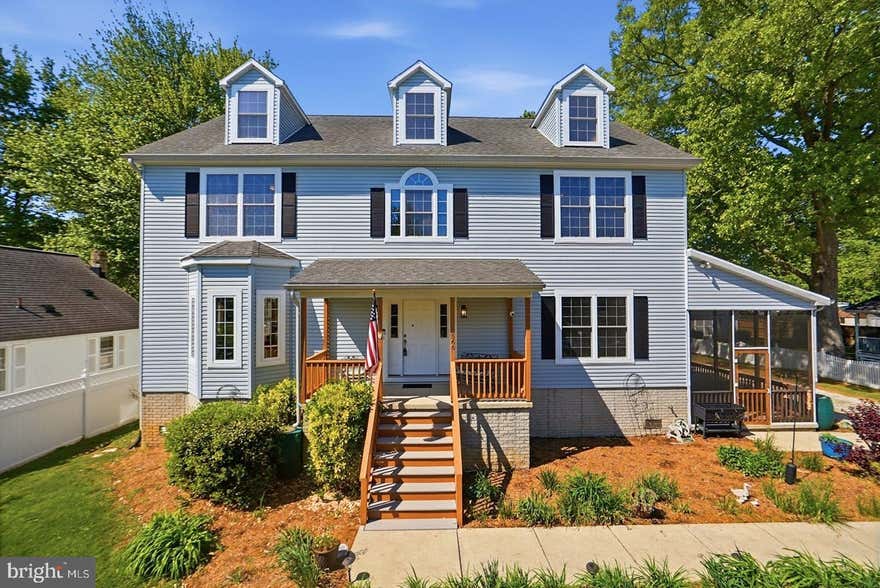 Welcome to 5566 Franklin Blvd located in a peaceful waterfront community of Franklin Manor Beach.  Enjoy living by a private waterfront park that stretches a mile, with community piers, a private beach, a playground, and boat ramp.  This light-filled home on two lots with open Chesapeake Bay views, set outside the flood zone.  Spacious layout offers  2,600+ sf across two finished levels, with 4 bedrooms and 2.5 baths. The main level includes a flexible space to create a bedroom and a full bath. The bright primary suite features a walk-in closet. Quality details throughout: mahogany floors, crown molding, and abundant windows. Unfinished third floor (1,100 sf) with bay views and a bathroom rough-in offers expansion potential. Outdoor living includes a screened porch, a rear deck with a ramp, and a fenced yard. Built in 2008 with a raised foundation, dual-zone HVAC, two 200-amp panels, a backup generator, and 39 owned solar panels for efficiency. Oversized detached 2-car garage (720 sf).  One-year home warranty included.
