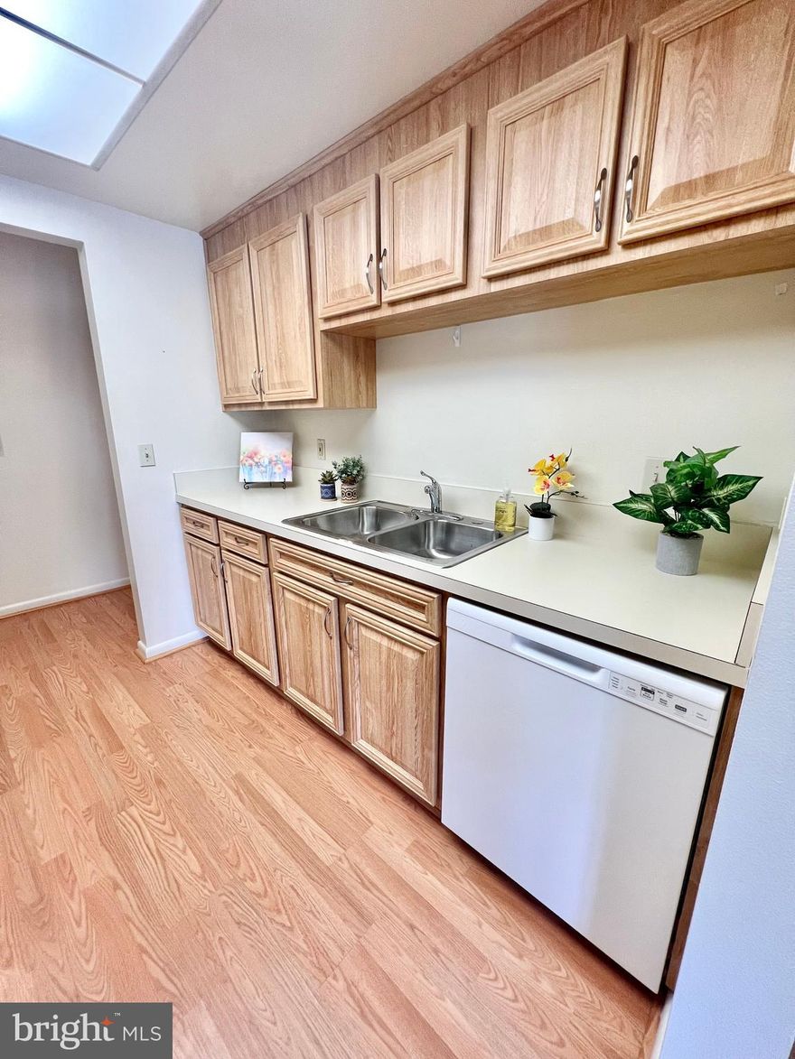 Gated 55+ Active Adult Community.  1 Bedroom "Blair" model unit in Montgomery Mutual!  This one has hard surface/wood laminate flooring in the updated Kitchen, Living and Dining Rooms.   Lots of updated cabinetry and countertop space in the kitchen which adjoins the Dining Room.  The large Dining room adjoins the spacious Living room, which provides sliding glass door access to the enclosed balcony.  It has a storage cage and an assigned parking space too!  Unit is to be painted during the Montgomery Mutual renovation/inspection process.  The monthly fee includes both the Co-op and HOA fees, all utilities, basic cable TV, Wi-Fi, property taxes, most maintenance of the unit, appliances and HVAC, PLUS all of the wonderful amenities in this gated community.  It's resort living – with 2 cluhouses, a fitness center, indoor and outdoor pools, walking trails, tennis courts, game rooms,18 hole golf course, restaurants, clubs, activities, and much, much more!  And the grounds are so beautiful with abundant green space and delightful wildlife.  Come see for yourself!