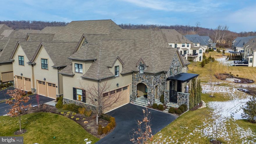 This exquisite home located in the prestigious  Reserve At Creekside Community  a much sought after Community of Castel Like Townhomes, is nestled in a pristine Setting of Whitemarsh Township.  The End Unit boast of approximately 3500 square feet of living space.  With it's gourmet kitchen and top of the line Monagram  stainless steel appliances,  farmers sink, beverage center, quartzite and so much more.  Enter into this stunning property with a  spacious living room, featuring a gas fireplace with floor to ceiling  Glass French  Doors on either side leading to a custom Pergula for your enjoyment.  Spacious Deck from the kitchen for entertaining.  Owners Retreat on the first floor with a stunning ensuite.  Finished Walkout Basement with a sliding door to a stamped concrete patio.  This gorgeous  home is located on a premium lot with $200,000 in upgrades done with the builder.  Each floor is zoned for comfort.  Upgrades, plus property disclosure will be uploaded as well a video and professional photos.  Very easy to show.   The outside has custom upgraded steps and  railings to front door landing plus to Pergula.      Club House features Pool, Fitness Center Gathering Party Room and so much more.