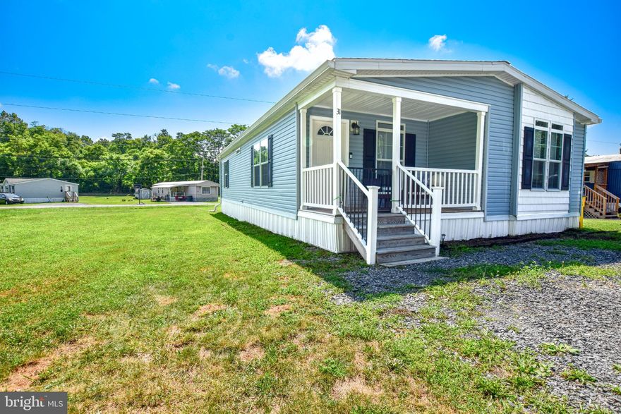 This 3- bed, 2-bath manufactured home is the perfect blend of comfort and style. As you step inside you will notice that the living room flows seamlessly into the eat-in kitchen creating an area perfect for entertaining. Not only are the two spaces thoughtfully connected but the updated kitchen offers shaker style cabinets and an oversized island with seating. Passing through the living room you will find all three bedrooms and two bathrooms including a primary bathroom with an ensuite. If that isn’t enough to want to call this place home, it is also within minutes to I81 making it a perfect choice for commuters to MD/VA.