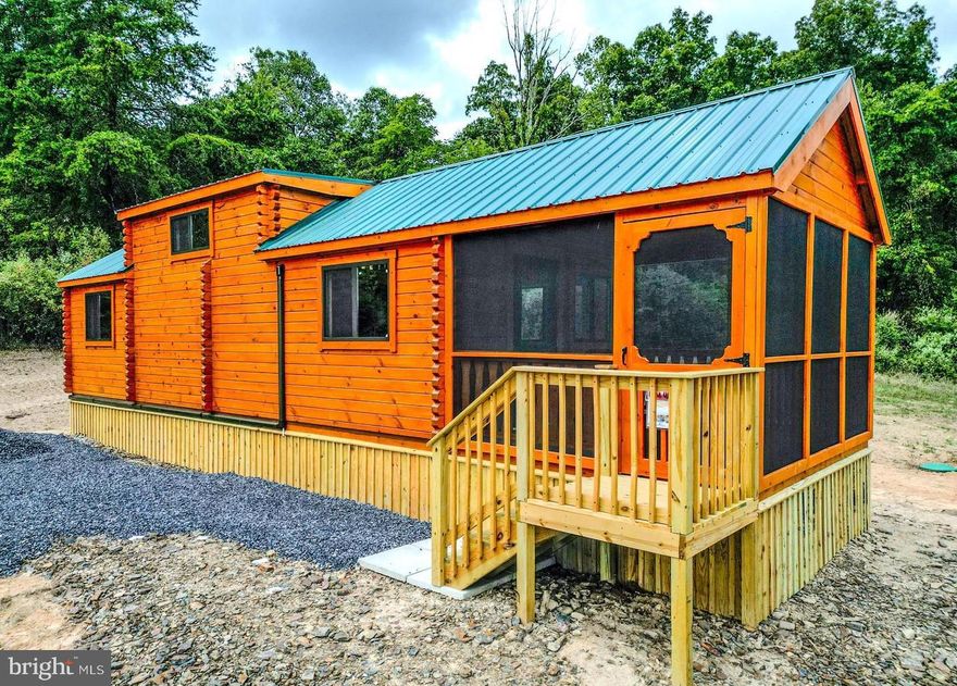 SELLER MOTIVIATED - BIG PRICE REDUCTION!!  **Rustic Yet Contemporary Tiny Home Log Cabin in the Heart of the Appalachian Mountains**  Discover the charm and freedom of living in a true log cabin nestled in the heart of the Appalachian Mountains. This property offers no HOAs to burden or infringe on your freedoms! Whether you're just starting out as a homeowner or considering a real estate investment, you can't go wrong with this delightful cabin.  Owning this property is less expensive then current rental payments.  Investors - the STR opportunities are endless here!  Rustic Yet Contemporary Design!  With functional use of space every inch of this cabin is designed with practicality in mind.  Relax and enjoy the outdoors year-round in any weather on your spacious enclosed porch. The living area offers ample space for a comfortable retreat after a day of adventure.  The fully functional Kitchen includes a breakfast bar for casual dining, all the necessary appliances for convenience with sufficient counter and cabinet space.  Full sized bathroom equipped with all the essentials for everyday living.  The Main Bedroom is 12x10 (approx)  and  can accommodate a king or queen bed with ease or 2 doubles. Washer/Dryer Hookups are included.  There is a Computer/Desk/Storage Area that can easily accommodate bunk beds for additional sleeping arrangements if needed or be utilized as a pantry or large closet.  The massive loft 11x17 (approx) provides space for two queen mattresses, perfect for guests or extra family members.  Mini Split Heat/AC for efficient heating and cooling for year-round comfort that is reliable and convenient.  Metal roof with gutters and downspouts to keep the cabin well-maintained.  Hassle free public water supply.  All situated on an easily maintainable 1.35 acre lot located perfectly near all that West Virginia has to offer, including skiing, fishing, boating, hunting and hiking.  Just minutes off Corridor H/US 48 and close to popular attractions such as Seneca Rocks, Davis/Thomas, Spruce Knob, Vepco Lake, Potomac River, Canaan Valley Ski resorts and Blackwater Falls.  This delightful, affordable, and sensible investment is perfect for anyone looking to embrace the Appalachian lifestyle. Don't miss out on the opportunity to own a piece of mountain paradise before it's gone!!!