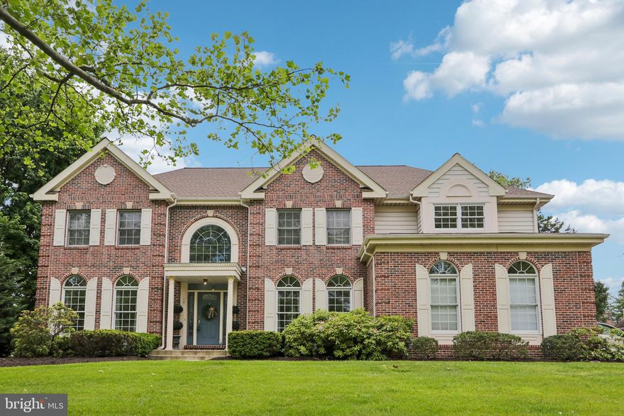 Elegant, custom built De Luca brick-front, light filled Center Hall Colonial situated on a grassy knoll with a level lot on 1.6 acres, in Council Rock Schools! Upstairs off the bridge overlooking the family room and foyer, the main primary suite offers a lovely tray ceiling, large sitting room area, two large his & hers walk-in closets and separate bath, shower, toilet areas ( with hookups for upstairs laundry if desired), the three other bedrooms are spacious, the hall bath offers double sinks and tiled tub/shower. Two full and two  half baths altogether with the powder room off the kitchen and a powder room in the huge finished basement.  The upgraded kitchen  features newly installed, white marbled quartz kitchen countertops, new ceramic sink and faucet, new stainless steel appliances and brand new cook top, with cathedral ceilings in the foyer and family room featuring a magnificent stone floor-to-ceiling wood burning-fireplace! The entire first floor features  9ft ceilings well as  cathedral ceilings in the family room & foyer! Beautiful and inviting light filled spaces from the formal living room, formal dining room, library/office, open concept kitchen and laundry room with outdoor access to patio from kitchen sliders and rear laundry room door. The expansive  bright and organized stylishly finished basement includes a wall of custom built-ins,  ideal for entertaining, game room, hobby area or media room. The exercise room equipment will remain, loads of extra storage  space as well. Bonus feature is the cost effective and money saving permanently installed south facing solar panels, that are fully owned and paid off, netting almost zero electric utility costs throughout the summer months and very low electric cost during sunny spring and fall weather!This home is located in the  lovely Wedgewood Green community, built by DeLuca, which backs to Spring Mill Country Club golf course. Open House Saturday & Sunday May 30th & 31st 12:00-3:00PM!