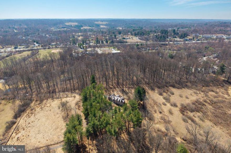 Located at 1004 Garrett Mill Road, this unique offering presents an opportunity to own a scenic parcel in a highly desirable Radnot Hunt setting. Set along one of the area’s designated scenic roads, the property encompasses approximately 10 acres surrounded by preserved open space and conservation land, offering exceptional privacy and natural beauty. 
The existing structure on the property is uninhabitable and is being sold strictly as-is. Buyers are advised not to enter the dwelling. Value is in the land only.
The property is subject to a conservation easement, which restricts future development and limits permitted uses. Ideal for buyers seeking a private retreat, recreational use, or long-term land hold within a protected landscape.
Property includes open and wooded areas with picturesque views and proximity to equestrian trails and preserved lands. 
Buyer is responsible for all due diligence regarding zoning, easement restrictions, and potential permitted uses.
________________________________________