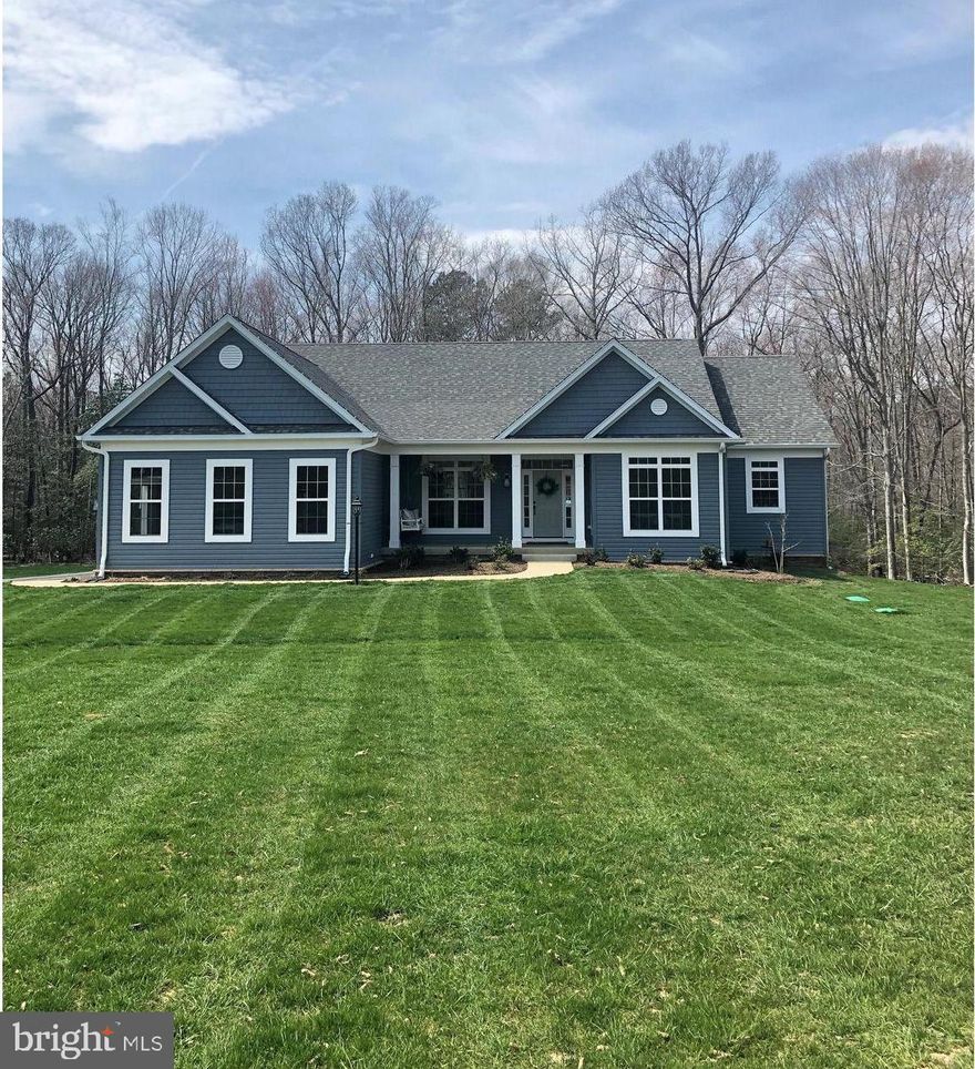 This one is BEAUTIFUL!! One year old with all the bells and whistles. This home on 3.12 acres backs to over 100 acres of Forest Conservation, sits in a cul de sac and is on a very private lot. Almost 3800 sqft of finished living space with open concept floor plan. Gorgeous upgraded chef's kitchen features 42 inch white cabinets, quartz countertops, commercial 6 burner gas cooktop and range hood, double wall ovens, farmhouse sink, oversized center island, and sitting/breakfast nook. Family room with tons of natural light includes gas fireplace with custom mantle and built ins. Spacious master suite features super bath with soaker tub, large separate shower, double vanities, and two large walk-in closets.  Formal dining room, two additional bedrooms with jack and jill bath and 1/2 bath round out main level. Walk out basement with extra bedroom, full bath, and huge recreation room along with tons of storage space. Additional features include 16x18 trex deck overlooking nothing but trees, custom lighting, engineered hardwood flooring, extra-large windows,9 ft ceilings on main level and basement, custom tile in master bath and 2 ft bump-out on garage. This one is a 10!!