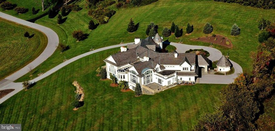 We have reduced the price again.  This will give you additional funds to make all the custom renovations you desire.  This will require approval of the second mortgage lender, but we are advised that should not be difficult.   

This home is in the gated Sussex community, the most prestigious and exclusive community in the West Chester area.  This property comes with lots 12, 13 and 14 (see Photos).  This was the original home in the Sussex community.  When built, cost was not an issue. The trim in this house is something to be seen.  The house has Deep coffered ceilings, very large crown molding and baseboards deep and large enough to hold the electric outlets.  There is a private bar on the first floor.  The lower level was improved with another bar, kitchen, theatre, conference room, laundry, exercise area and private offices.

 The extra bedroom and bath on the first floor were damaged by fire and are framed and ready for new life.  There is some damage to the outside near this room.  Some windows are in need of replacement.  This house will need some work to restore it to its former glory, but it will be worth it.  The owner selected this lot for his home because of the spectacular  views from most of the windows.

This is an estate sale so there will be no Seller's disclosure.  We invite full inspections.
. 
The HOA fee is $2,000/yr PER LOT, there are 3 lots, each of which is a building lot.