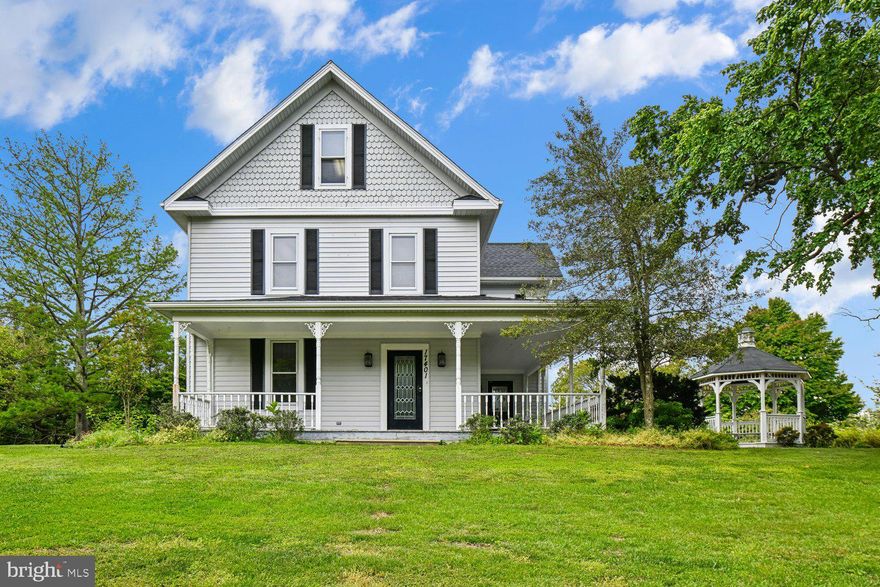 Multi-generational horse farmette only 25 miles from Washington, DC
5 BR | 4 BA | 4,679 SQ FT | 7.23 ACRES

Rarely does a multi-generational horse farmette of this caliber become available this close to Washington, DC. This Victorian farmhouse blends historic character with modern updates, offering 4,679 square feet on more than seven acres of Maryland countryside.

A welcoming front porch and original hardwood floors lead into a modern addition featuring a soaring great room, gourmet kitchen with a sun-filled breakfast nook, and a spacious first-floor primary suite with a jacuzzi tub, dual sinks, and dual walk-in closets. The layout offers the flexibility for comfortable single-level living on the main floor while still providing additional bedrooms and living space throughout the home.

The thoughtfully designed interior also includes a formal dining room, large walk-up attic, expansive storage areas, and flexible living arrangements suitable for multi-generational living, guest space, or potential income-producing use (buyer to verify). A three-car garage with a full bathroom provides additional space for vehicles, hobbies, or a workshop.

The equestrian facilities are a standout feature, including a two-story, three-stall center-aisle barn with dedicated tack and hay storage, water, and electricity. The grounds are well-suited for horses and livestock, featuring a fenced paddock with a run-in shed and water access, as well as a separate fenced pasture. Additional outbuildings include a chicken coop, a tool shed, and an oversized carport.

The property directly borders approximately 250 acres of protected state land with riding trails and frontage along the Patuxent River, creating direct access to outdoor recreation and riding opportunities.

Located along the Legacy Wine Trail, the property offers a rural setting without complete isolation. Approximately 10 minutes to public boat launches and within convenient reach of Brandywine, Waldorf, Upper Marlboro, MD, and surrounding D.C. commuter lots and routes.

Significant capital improvements since 2022 include a new roof, fascia, and gutters with guards; two heat pumps; a high-efficiency heat pump water heater; chimney upgrades; refinished hardwood floors; granite countertops; luxury vinyl flooring in the addition; updated bathrooms; and fresh paint throughout.

This is a rare opportunity to own a functional horse property with acreage, flexibility, and direct access to both nature and nearby conveniences.