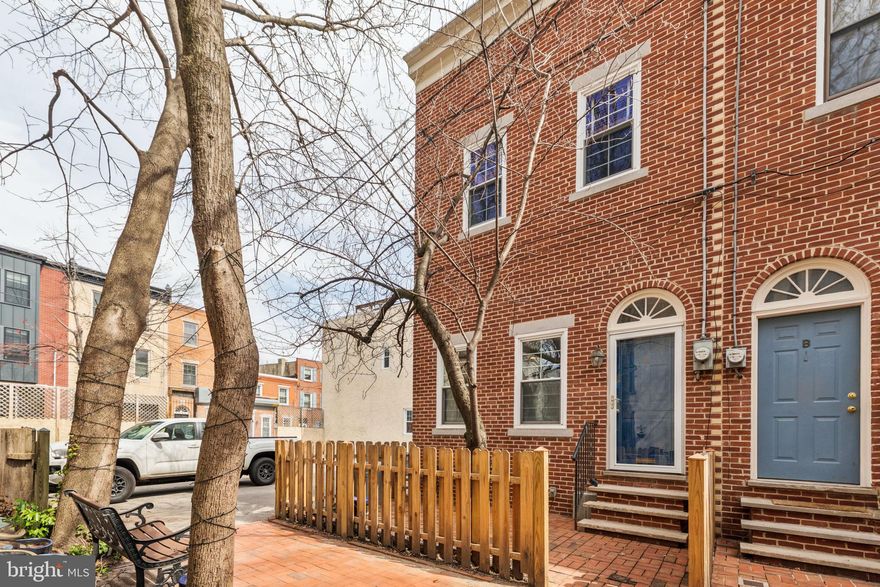 1811 Fitzwater St. #A is a 3-bedroom, 2.5-bathroom corner home in the heart of Graduate Hospital, located in a private, gated community, offering secure 2 car parking, and 2 outdoor spaces. The first floor features a bright and spacious open-concept living area with fireplace that flows seamlessly into the designated dining area and the eat-in kitchen, complete with a breakfast bar, stainless steel appliances, and ample counter and cabinet space. A convenient half bath is also located on this level. Upstairs, the second floor boasts three generously sized bedrooms, two full bathrooms, and a washer and dryer for ultimate convenience. Enjoy the fully fenced-in, large rear patio with an office shed and gas grill hook up. Additional outdoor space includes a front garden. With a newer roof and siding, this home is move-in ready and offers the perfect blend of comfort, convenience, and city living. Just steps away from Marian Anderson Rec Center, and multiple excellent dining options, this home also offers easy access to the vibrant shopping and dining scene of center city.