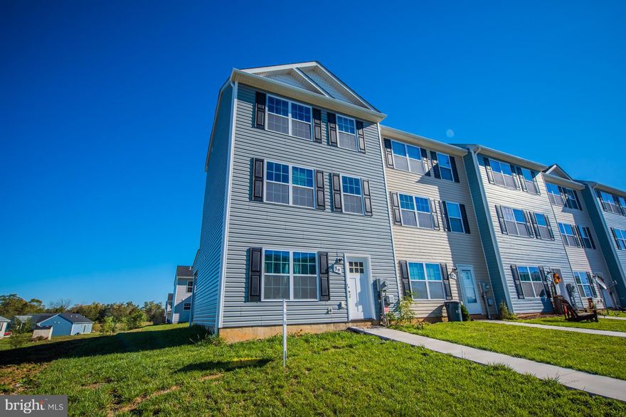 One year old end unit Town Home. Strategically located 10 minutes into West Virginia.  This home features upgrades galore.  42 inch kitchen cabinets and stainless steel appliances.  Beautiful third floor master suite; with a huge walk in closet and an amazing master bath,coupled with complete privacy.  Impeccably maintained.  Ready for immediate move in.  Limited availability in this community.