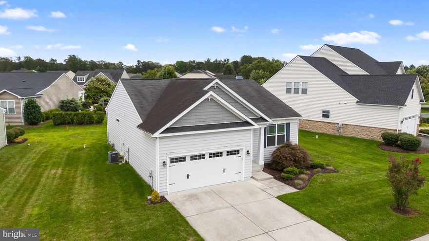 Welcome to this stunning 3-bedroom, 2-bath home in the community of The Villages of Red Mill Pond. This meticulously maintained single ranch residence offers a perfect combination of modern amenities and timeless charm. Step inside to discover a spacious and inviting interior. The family room is a true highlight, boasting a stunning cathedral ceiling and an impressive stone wall with a cozy fireplace with direct propane line and remote control– perfect for relaxing on cool evenings. The family room has been thoughtfully extended by an additional 6 feet, providing extra space for gatherings and entertainment. Cook up a storm in the open kitchen equipped with GE stainless steel appliances. The kitchen also features sleek granite countertops and a tiled backsplash. Adjacent to the kitchen, the open floor plan seamlessly flows into the family room, creating a harmonious space for both daily living and special occasions. French doors lead you out to a Trex deck, where you can enjoy outdoor dining and entertaining. The open view from the rear deck will provide you with many days and nights of peaceful and private days and nights.....whether you are reading your book, chatting with friends, or dining al fresco. The deck is complemented by a direct propane line built in for your BBQ grill. No need to run out to fill up your propane tank for grilling, and never run out! The well-maintained irrigation system, with sensor control, ensures your lawn remains lush and vibrant with minimal effort. Additional features include hardwood floors throughout all areas, except for the bedrooms, offering both durability and sophistication. The master shut-off valve is conveniently located in a cabinet accessible from the laundry room, eliminating the need to enter the crawl space. This distinctive location for the shut-off valve is unique to this home and a special addition provided by the homeowner. As part of a vibrant community, you'll also have access to a pickleball court and a sparkling community pool and clubhouse, offering endless opportunities for recreation and relaxation right at your doorstep. This ranch home combines comfort, functionality, and style in one perfect package. Don’t miss the opportunity to make this beautiful property your own. Schedule a showing today and experience the best of Lewes living! **The Red Mill Pond Community Amenities include: Community club house with fitness center, pickle ball courts, swimming pool & kiddie pool, and kayak launch into Red Mill Pond! You'll also have direct access to the Lewes Georgetown trail!**