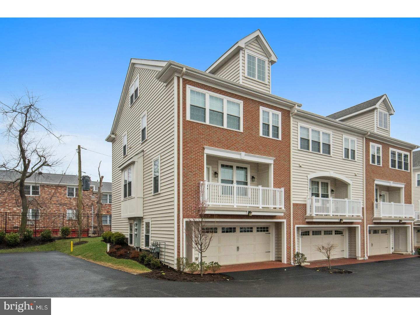Welcome to Village Square, a charming new community in the heart of Paoli, within walking distance to the train, shopping and dining. Everything you need is close by. Here is your chance to move right in to a finished END unit with extra windows and plenty of natural light! The classic exterior blends tastefully into the surrounding community with low maintenance materials. These townhomes are situated around a landscaped courtyard with ample guest parking and a walkway to near by shopping. Included on the first level is a 2 car garage with inside access and den. Head upstairs to the main floor of living area with gas fireplace, custom mantle and floor to ceiling built in bookcases. The kitchen boasts a quartz center  island and Carrera marble subway tile with upscale stainless appliances. On this level you will also find a powder room. Upstairs is the master suite with 2 over sized walk in closets, master bath with dual vanities and a large frame-less shower. Additionally, on this floor is the princess suite with private bath and spacious laundry room. Head up to the 3rd floor loft bedroom with reading nook, full bath and plenty of closet space. Crown molding in living room and master bedroom, multi-zoned heat and air. Enjoy this great location with easy access to the train and entertaining. Keep your weekends to yourself with no lawn or snow to occupy your time. Schedule your tour today!