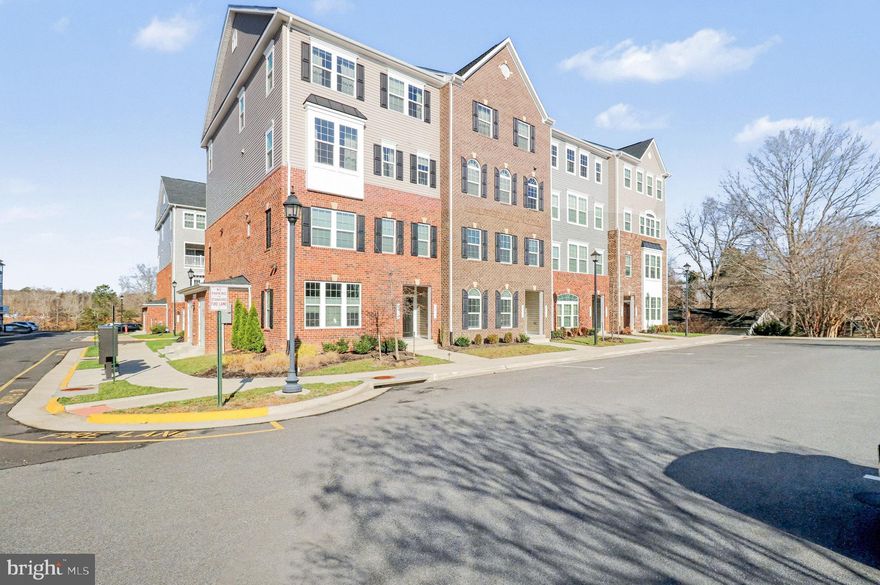 Welcome home to this immaculate former model end-unit condo townhome, built in 2022, in Independence Square and ideally positioned backing to the growing Spotsylvania Courthouse Village. With exciting new development underway nearby, this location offers both everyday convenience and long-term appeal.

Designed for low-maintenance living, this move-in-ready home showcases thoughtful upgrades and refined finishes throughout. The entry level features a foyer accessible from both the front door and garage, complete with auxiliary baseboard heating at both entries for added comfort.

The open-concept main level is ideal for entertaining. The stunning kitchen boasts an extended quartz island, upgraded cabinetry and backsplash, and a smart double oven. A light-filled eat-in area flows seamlessly into the spacious living room, which opens to a screened-in porch (the whole width of the home!) — perfect for relaxing.

The primary suite is a true retreat, highlighted by tray ceilings with crown molding, recessed lighting, two walk-in closets, and a spa-inspired bath featuring a double walk-in shower and private water closet.

Additional features include upgraded luxury vinyl plank flooring throughout the entire first floor and all bathrooms, smart thermostats for modern comfort and efficiency, and whole-house Wi-Fi conduit pre-routed throughout the home, including behind TVs for a clean and seamless setup. The epoxy-coated garage floor provides durability and a finished, polished look.

The condo fees include trash removal, water, & sewer in addition to exterior maintenance & landscaping.

Don’t miss the opportunity to own this nearly new former model home in a thriving community—schedule your private showing today and experience all that Independence Square has to offer.
