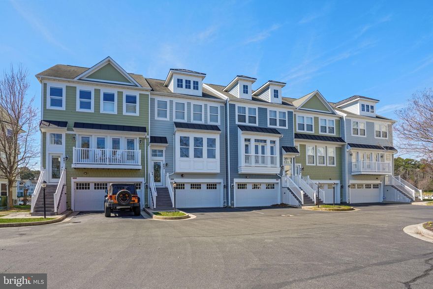 Welcome to 10900 Holystone Lane #402, a refined waterfront townhome tucked within the prestigious gated community of Glen Riddle... just minutes from the beaches, dining, and vibrant energy of Ocean City, Maryland. Perfectly positioned on a private “island” enclave within the sought-after Marina Villas at Glen Riddle, this exceptional residence offers a rare blend of low-maintenance luxury and resort-style living.  Overlooking the marina, this light-filled home offers truly extraordinary views that elevate everyday living into something special. From nearly every window, enjoy a dynamic coastal panorama where nature and waterfront life unfold before you. Watch bald eagles and osprey soar overhead, often returning with their latest catch, while boats glide in and out of the marina below. In the quieter off-season, the setting transforms into a peaceful retreat, while summer brings a lively, ever-changing scene, with the nearby boat ramp offering a front-row seat to all the action and a source of endless, built-in entertainment. This is a home where the views are not just beautiful...they are an experience.  Thoughtfully designed, the residence features three spacious bedrooms and three-and-a-half baths, with a flexible entry-level living space that can easily serve as a fourth bedroom, guest suite, or private retreat. The open-concept main living area invites effortless entertaining, while expansive windows flood the home with natural light and frame the stunning waterfront backdrop.  Lovingly maintained and very gently lived-in, this home reflects pride of ownership throughout. A recently replaced HVAC system offers added peace of mind, while the attached garage provides convenience and additional storage. Within the Marina Villas condominium association, exterior maintenance, including landscaping and upkeep, is expertly managed, allowing homeowners to enjoy a truly lock-and-leave lifestyle ideal for both full-time living and vacation use.
Glen Riddle is renowned for its amenity-rich environment, offering residents access to a private marina, two championship golf courses, a clubhouse with dining (Ruth's Chris Steak House), fitness center, outdoor pool, pickleball/tennis courts, and scenic walking trails. Boating enthusiasts will appreciate the opportunity to purchase or lease boat slips within the community, enhancing the coastal lifestyle experience. Whether you’re seeking a primary residence or a sophisticated second home, this exceptional property delivers unmatched views, convenience, and access to one of the area’s most coveted communities. Experience waterfront living at its finest...where every day feels like a getaway.  Professional Photos will be uploaded.