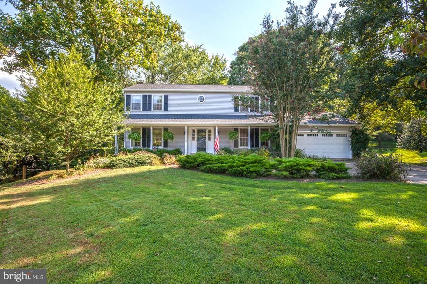 Beautiful 5BR/3.5BA colonial home located in Vienna & situated on a .53 acre lot. Picturesque front porch, private fenced yard w/large deck & backing to mature trees. New HW flooring & carpets. Newer roof, siding, gutters(2010).  2 story foyer, Lr w/gas FP, elegant chandelier, large eat-in KIT, sep DR. MBR suite w/MBA & WIC. Fin LL w/FR, wood stove, 5th BR, full BA & walk out lvl. Great location!